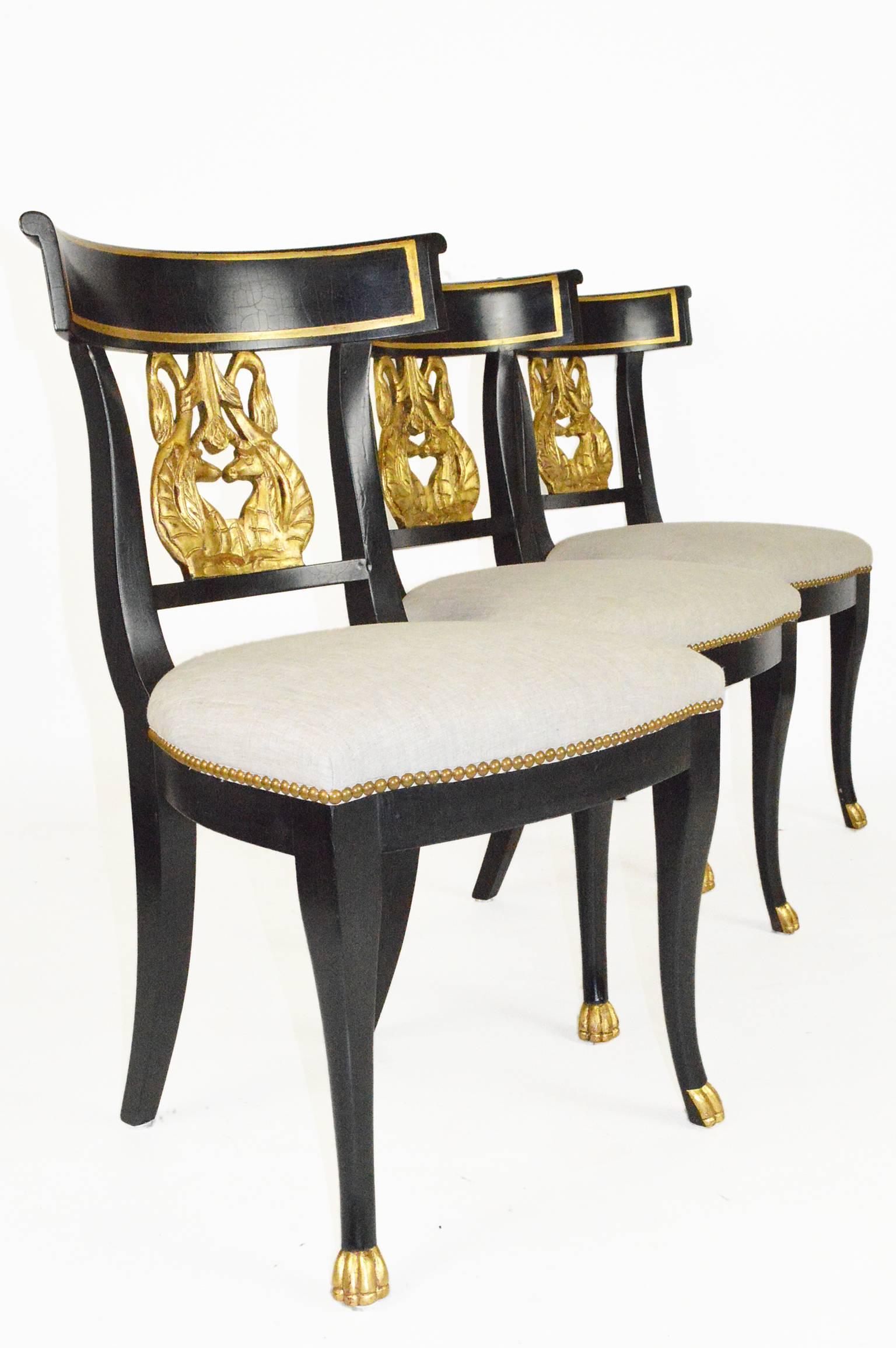 Set of Six Regency style ebonized and gilt side chairs.