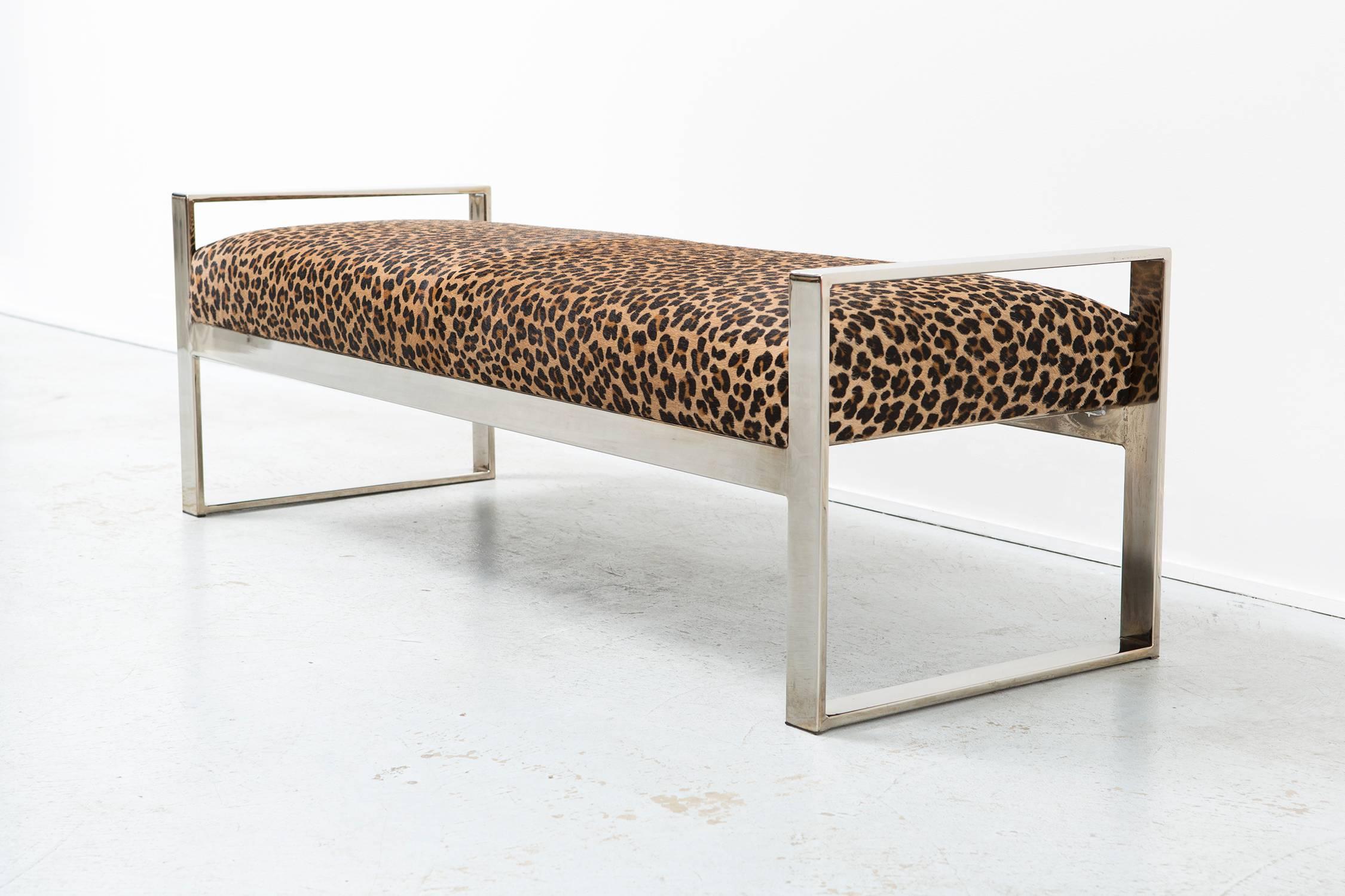 Bench

designed by Milo Baughman,

USA, circa 1970s.

Reupholstered in leopard patterned cowhide.

Measures: 18" H x 55" W x 20" D x seat 16 ½" H.