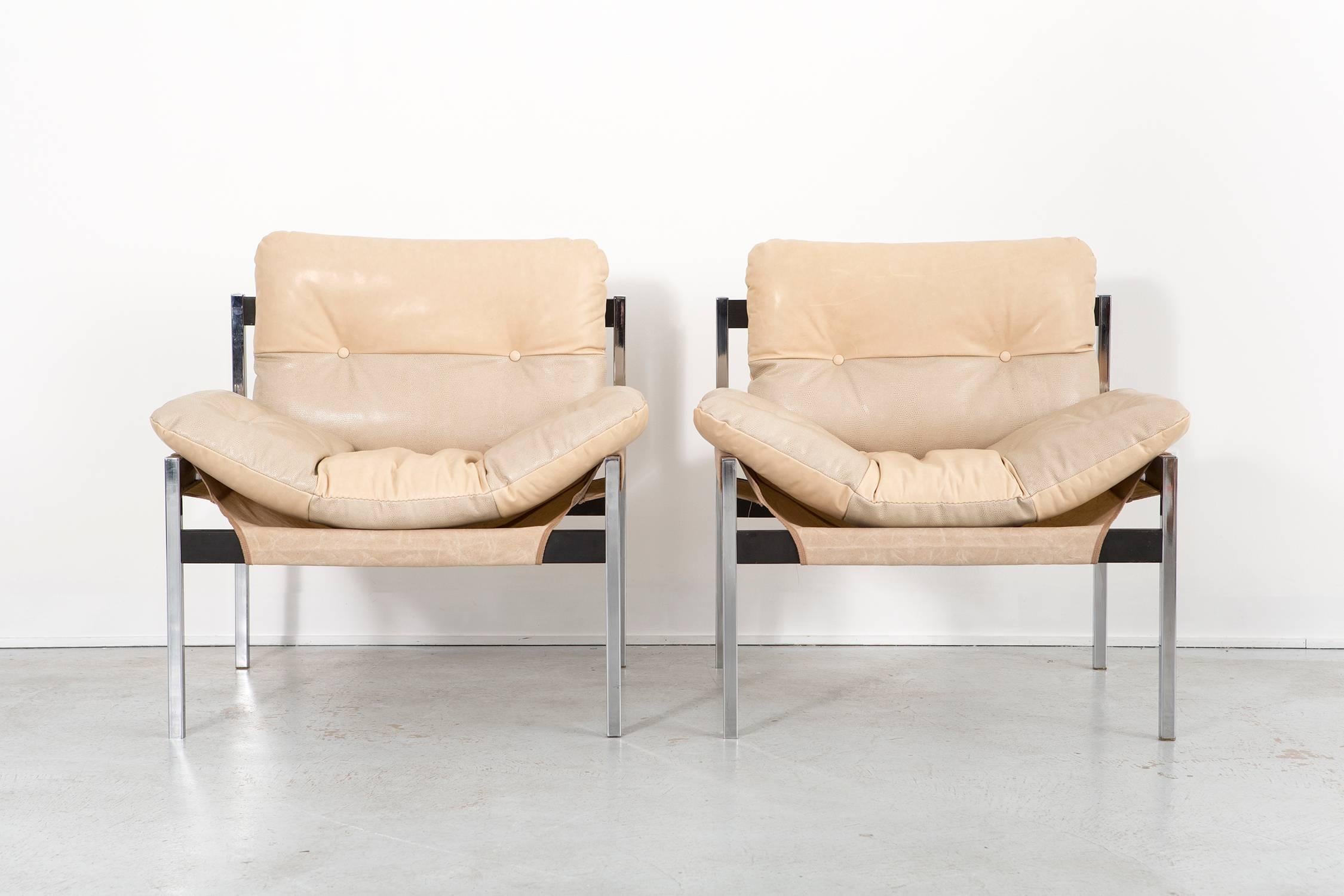 * Currently on hold *

Set of rare lounge chairs

#603 model

by Jerry Johnson and Byron Botker for Landes Manufacturing

USA, circa 1970s

Polished chrome, mahogany, waxed canvas (bottom cushions), waxed leather and faux iguana leather

Measures: