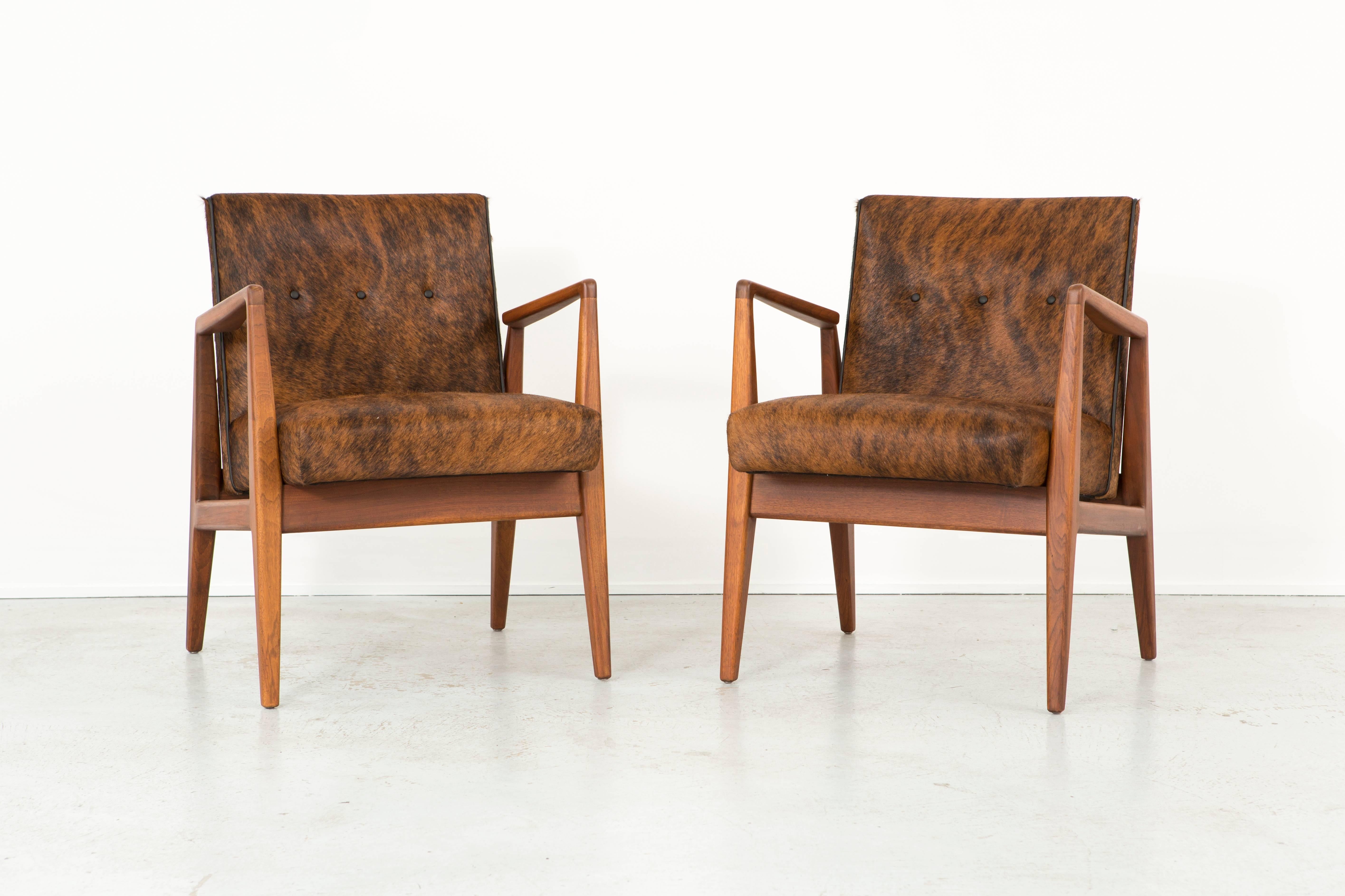 Set of two lounge chairs.

Designed by Jens Risom for Jens Risom Design,

USA, circa 1950s.

Reupholstered in Brazilian brindle hair-on-hide + walnut.

Measure: 31 ¼” H X 23 ¼” W X 24” D X seat 18 ½” H.

Wooden frames have been restored.

Sold as a
