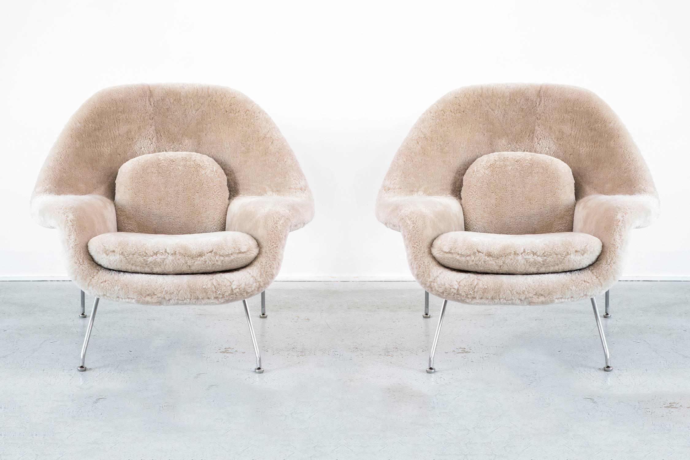 Set of Womb chairs

Designed by Eero Saarinen for Knoll

USA, d 1948 / circa 1960s

Reupholstered in wool shearling and steel frame

Measures: 35 ½" H x 40" W x 34" D x seat 16" h

Sold either as a set for $13,800 or