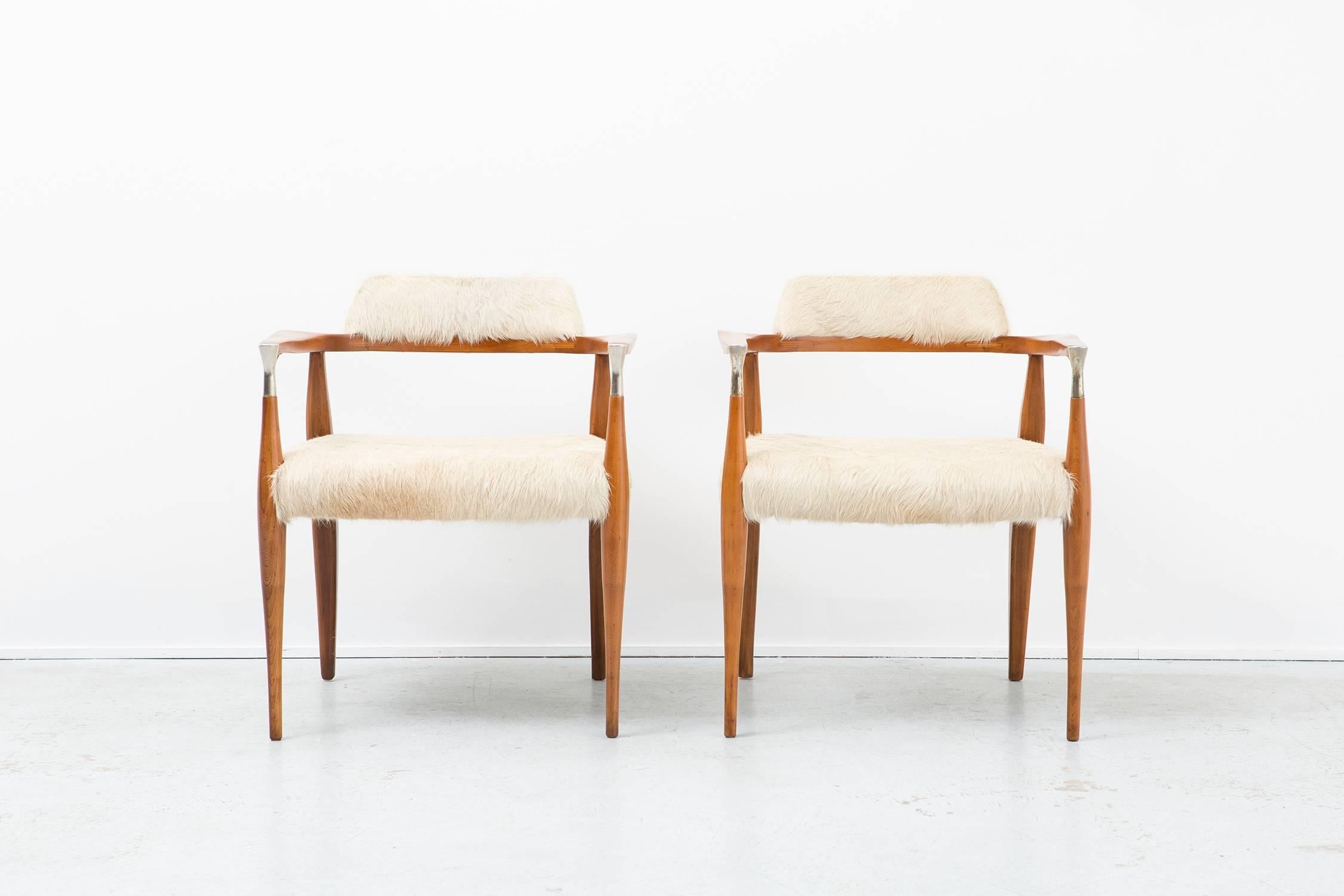 Set of two accent chairs

designer unknown believed to be American made 

circa 1950s

reupholstered in Brazilian cowhide

Measure: 29