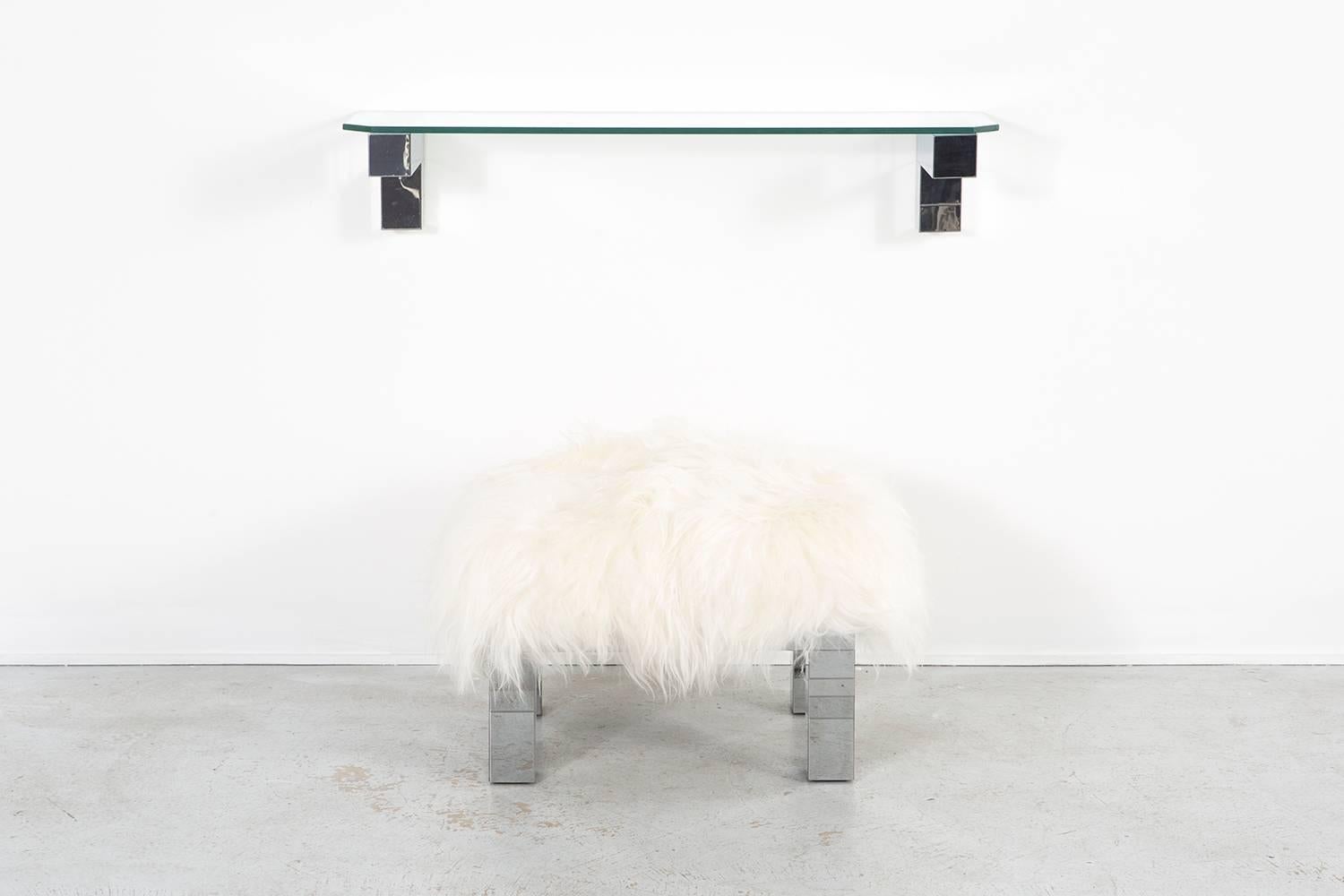 Floating shelf and stool set

designed by Paul Evans for Directional

USA, circa 1970s

chrome and glass with the stool reupholstered in Mongolian sheepskin

shelf 12 ½” H x 46” W x 12” D

stool 18 13/16” H x 26 ¾” W x 20 ¼” D x seat 18