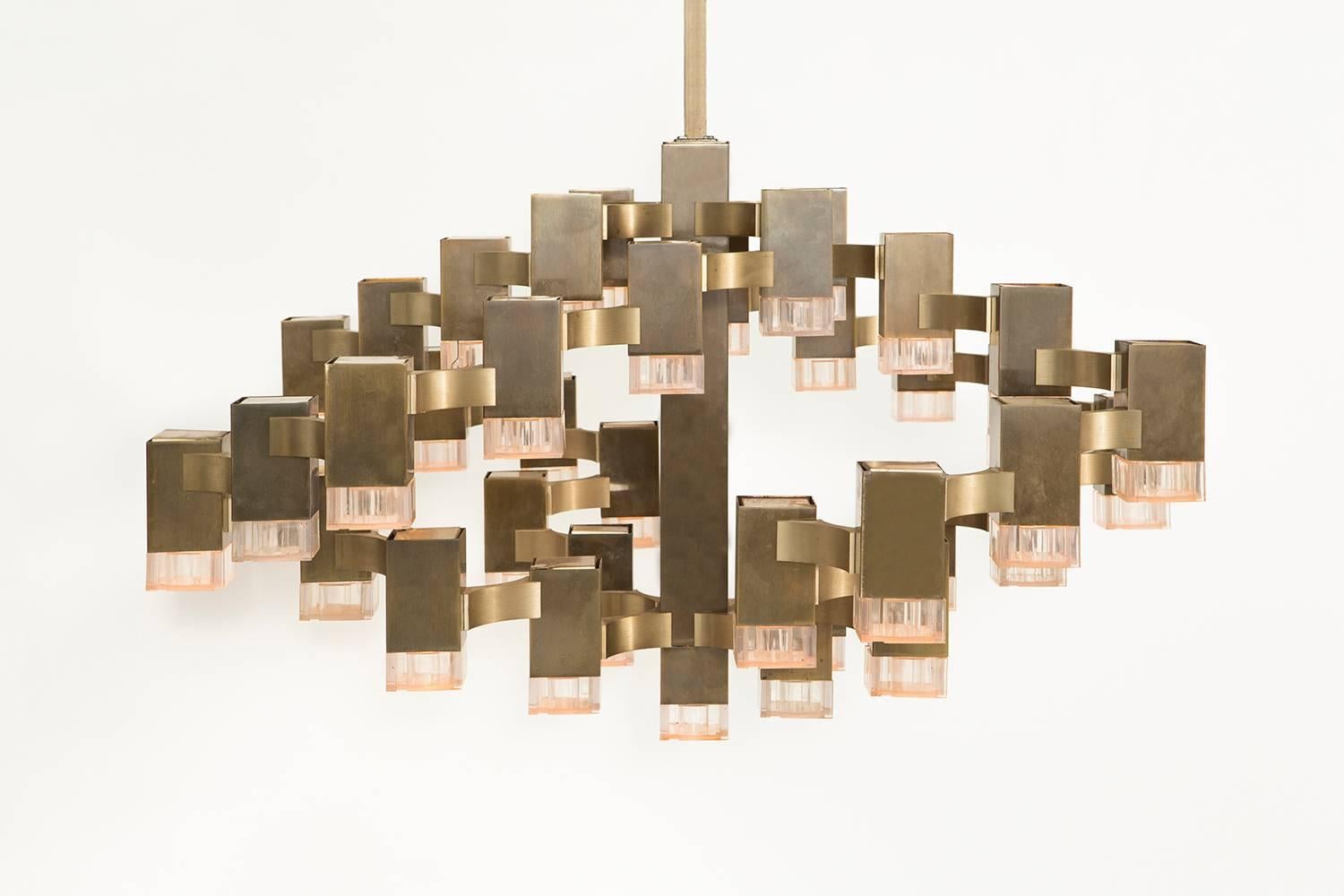 Cubic chandelier 

designed by Gaetano Sciolari

Italy, circa 1970s

holds 37 bulbs, brass + metal + acrylic

Measures: 20 ” H x 37” W x 37” D.