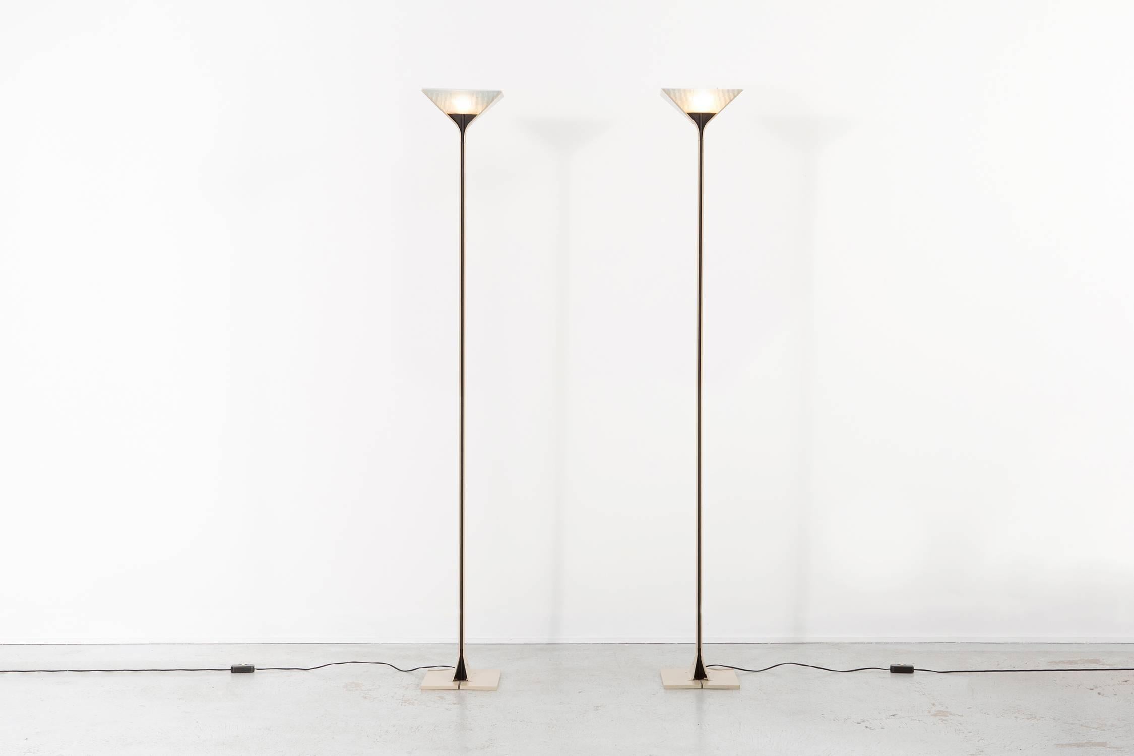 Floor lamps

designed by Tobia Scarpa for Flos

Italy, circa 1980s

steel and glass

Measures: 75 9/16” H x 10 ¼” W x 9 13/16” D

Sold as a set.