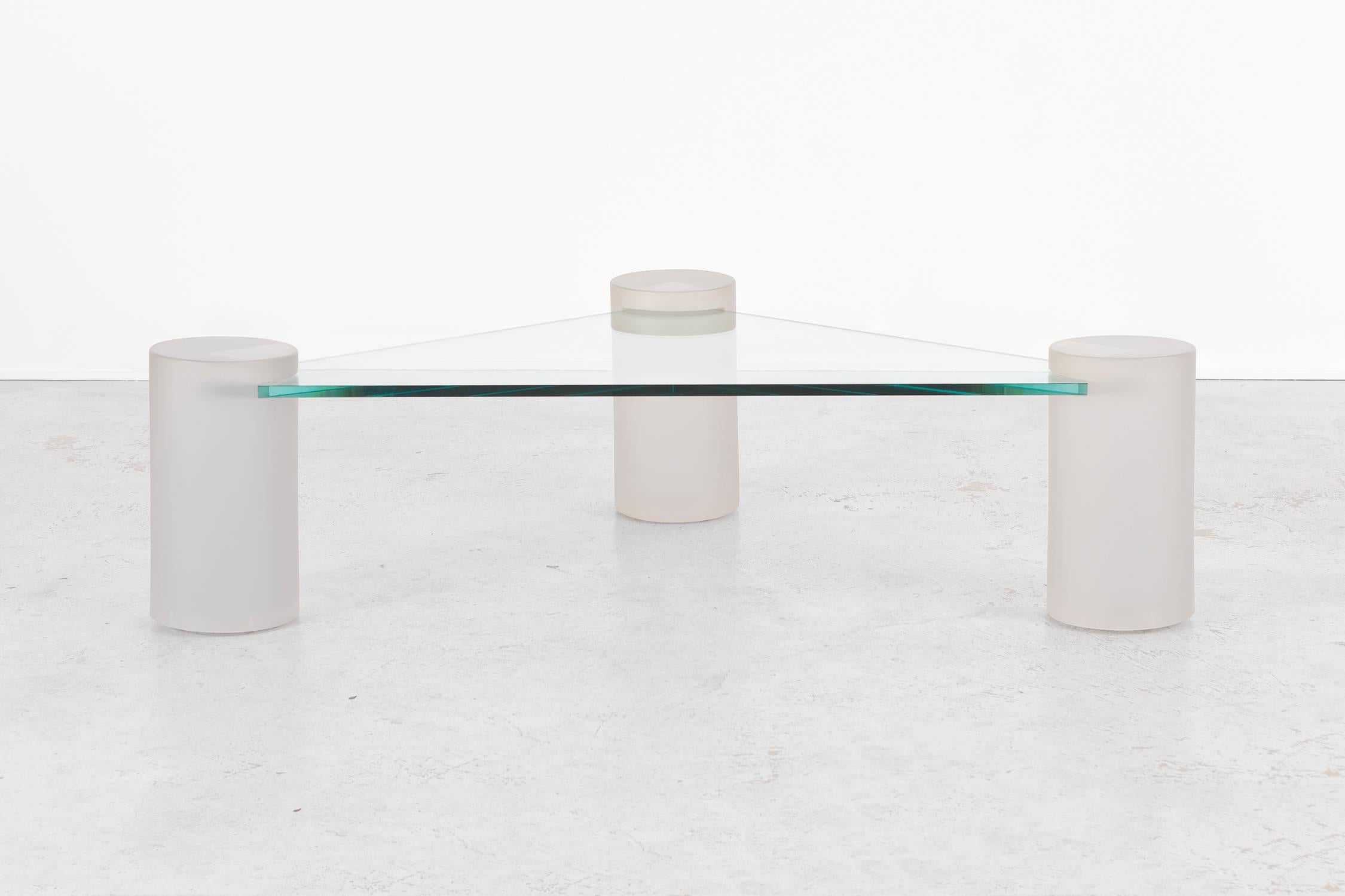 Sculptural coffee table

Designed by Lion in Frost

USA, circa 1970s

Glass top and three frosted cylindrical glass bases

Measures: 17