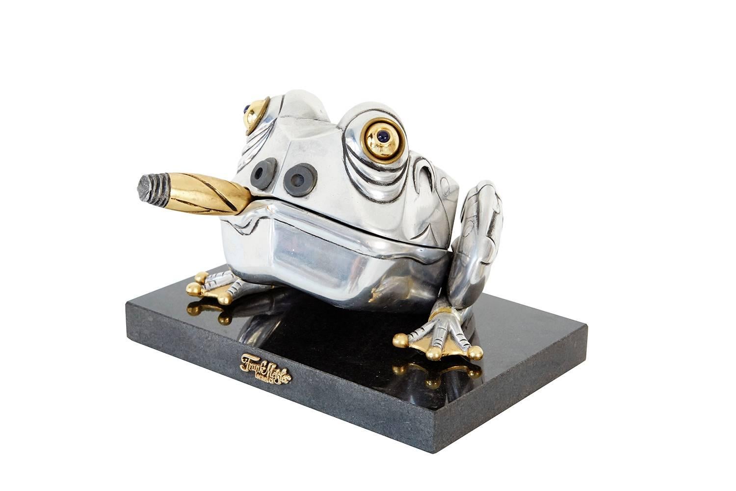 Frog box sculpture.

Designed by Frank Meisler.

Silver and gold plated metal box on black marble base, interior gold and silver fly.

Dimension: 6