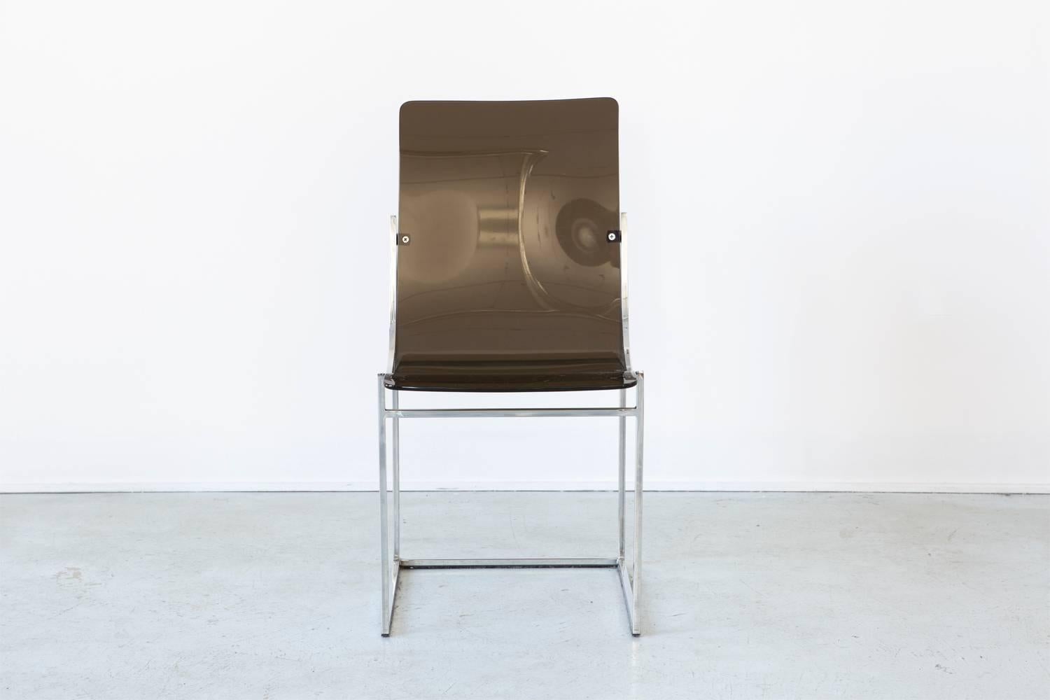 Occasional chair.

Black Lucite and chrome, circa 1960s.

Measures: 35" H x 17 ⅞" W x 26 ¾" D x seat 17 ⅞" H.
