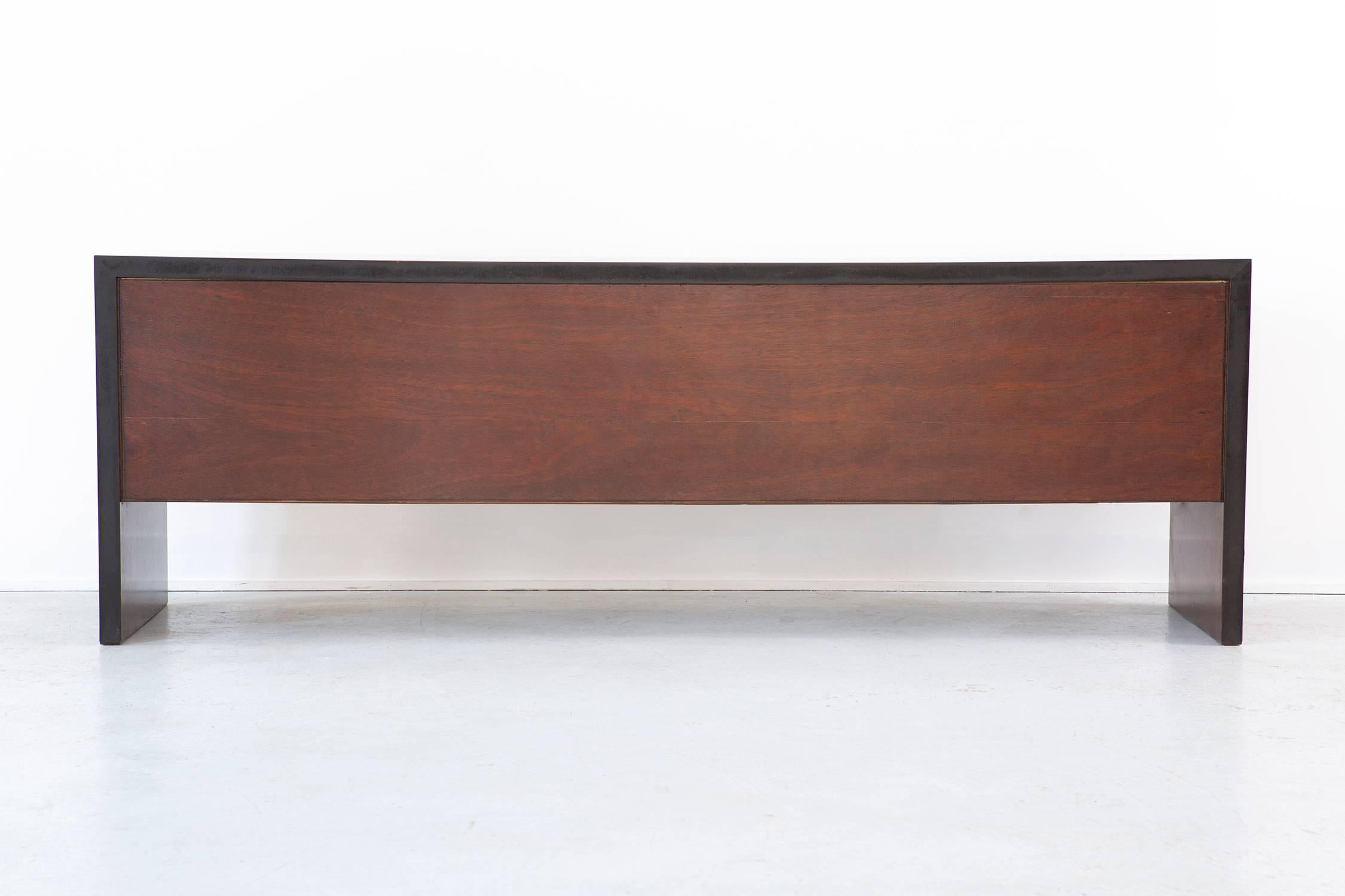 Credenza

by Dunbar,

USA, circa 1980s.

Rosewood and walnut. 

Measures: 27" H x 79 ½" W x 18" D.

Original Dunbar stamp included.