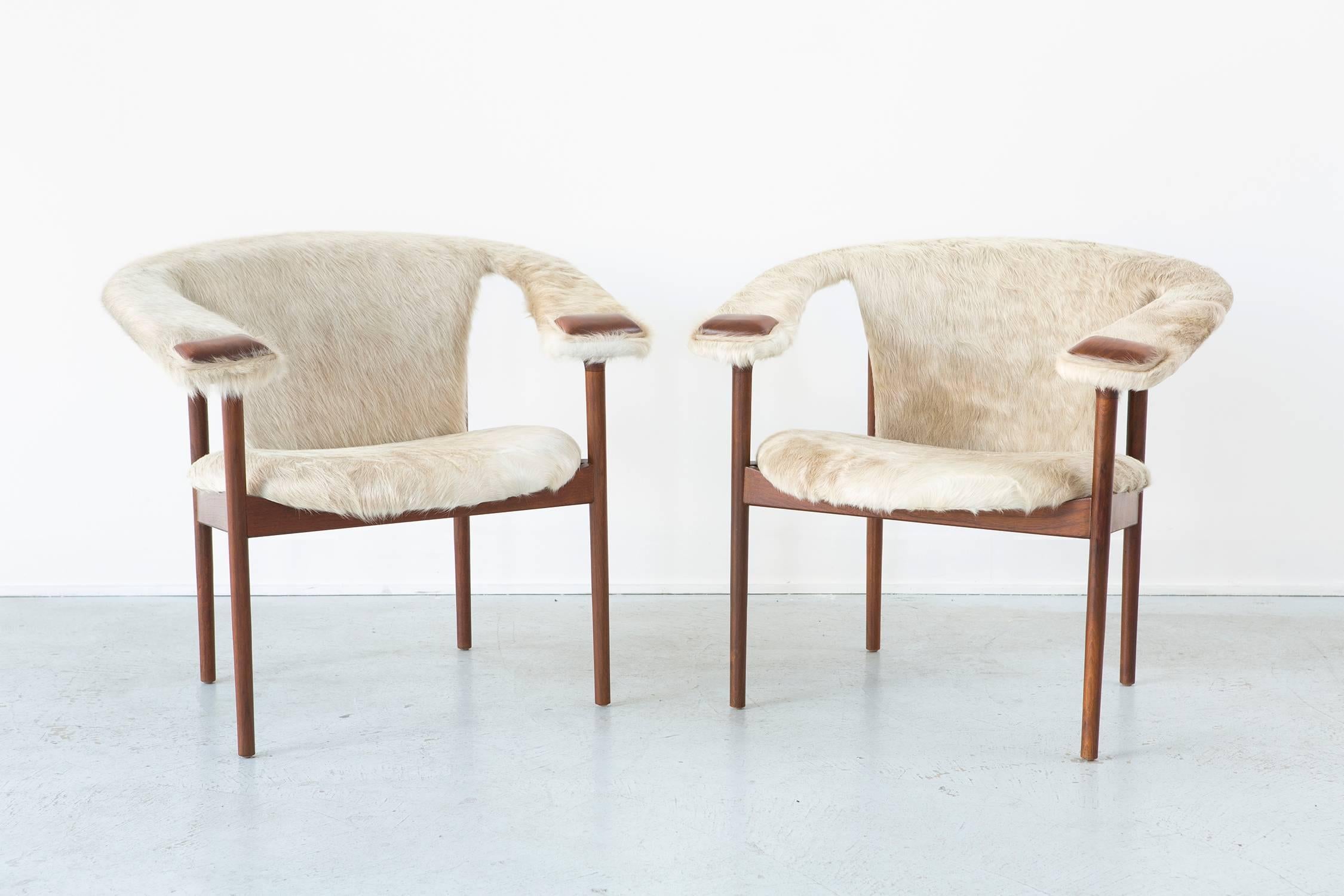 Rare set of lounge chairs.

Designed by Adrian Pearsall for Craft Associates,

USA.

Reupholstered in Brazilian cowhide with walnut frames refinished. 

Measures: 29 ¾" H x 32" W x 27 ½" D x seat 18" H.

Sold as a