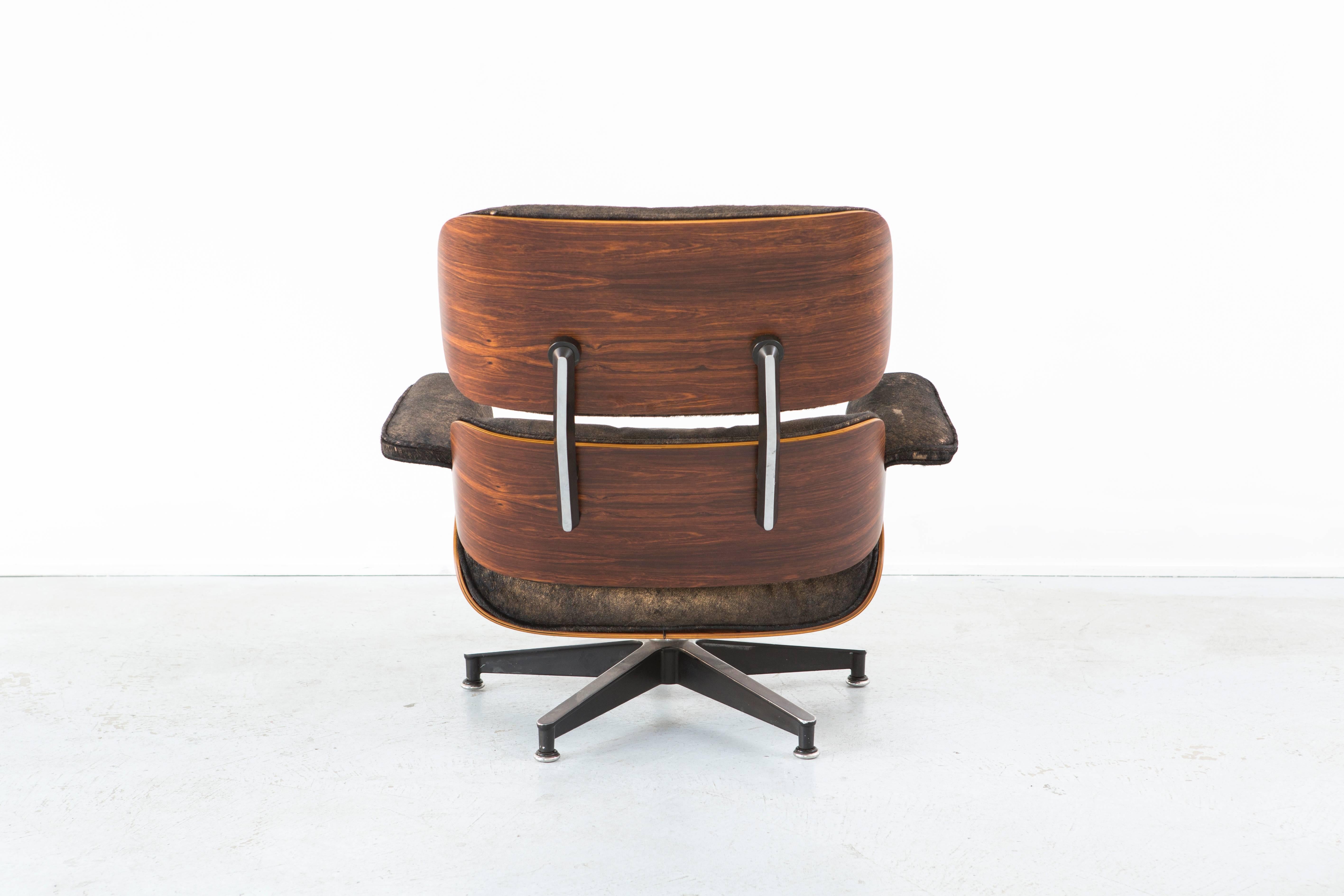 Mid-Century Modern Rosewood Eames Lounge Chair and Ottoman Reupholstered in Acid Washed Cowhide