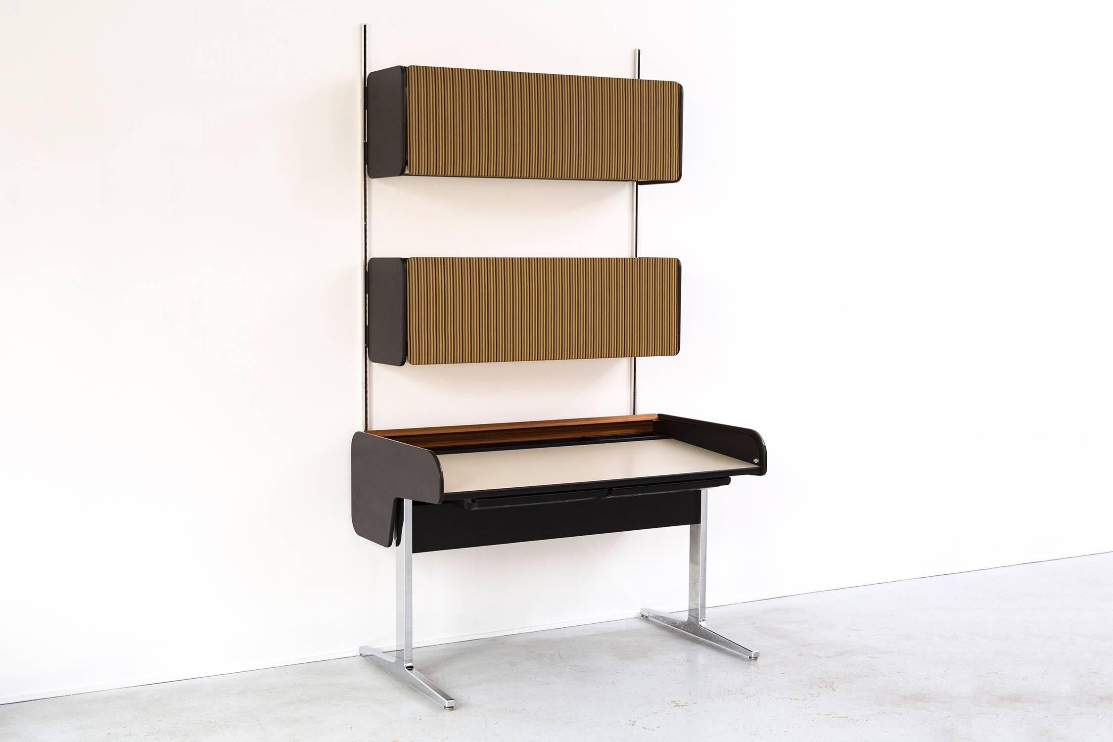 Action office desk and wall unit. Rare intact entire set with the original fabric doors on the wall unit.

Designed by George Nelson for Herman Miller.

USA, circa 1960s.

Wood, metal and fabric.

Measures: 73 ½
