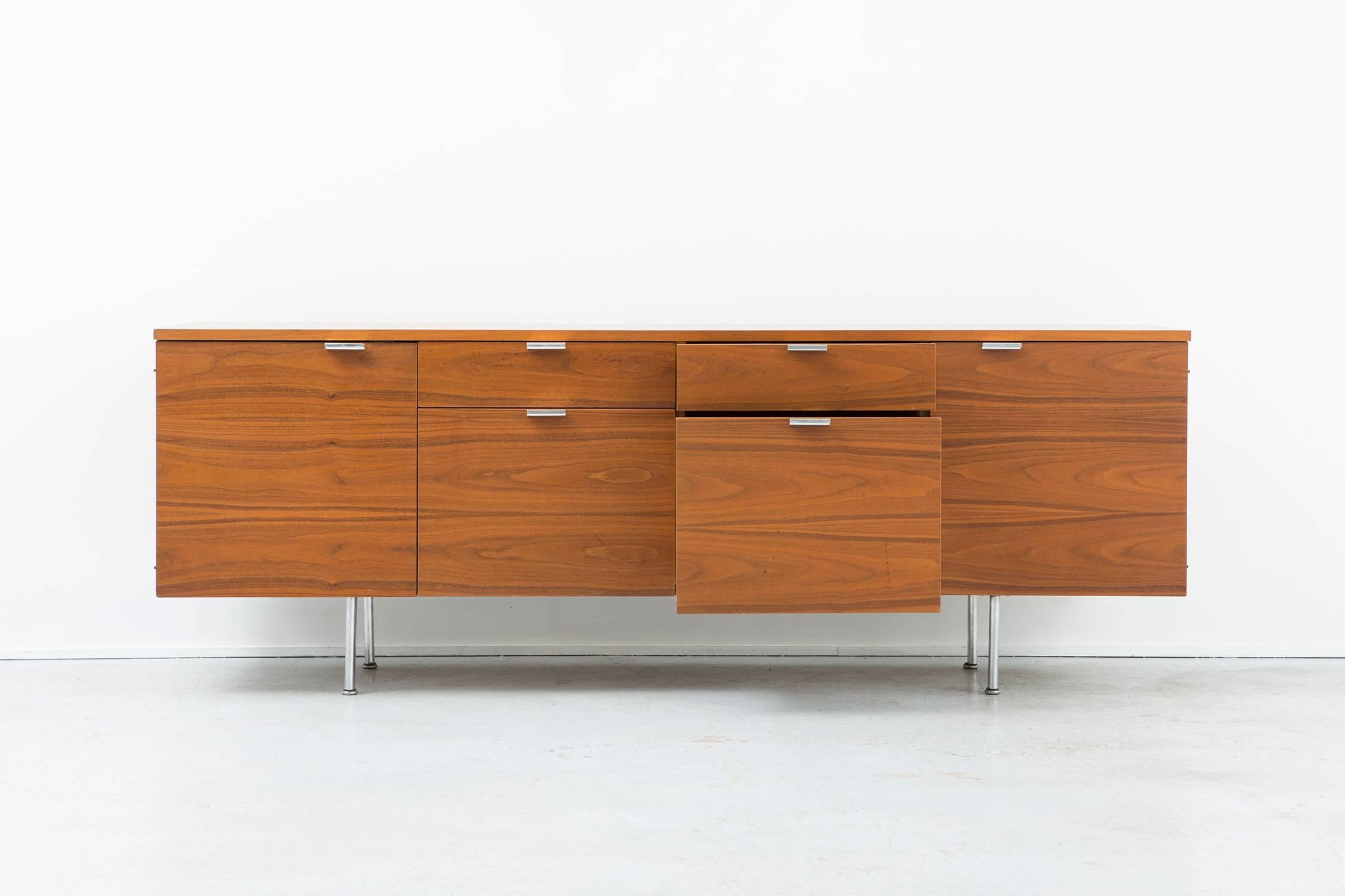 Credenza,

designed by George Nelson for Herman Miller.

USA, circa 1960s.

Wood and metal.

Measures: 26 ¾" H x 74 ¼" W x 19 ⅜" D.

Herman Miller medallion intact on the piece.

 