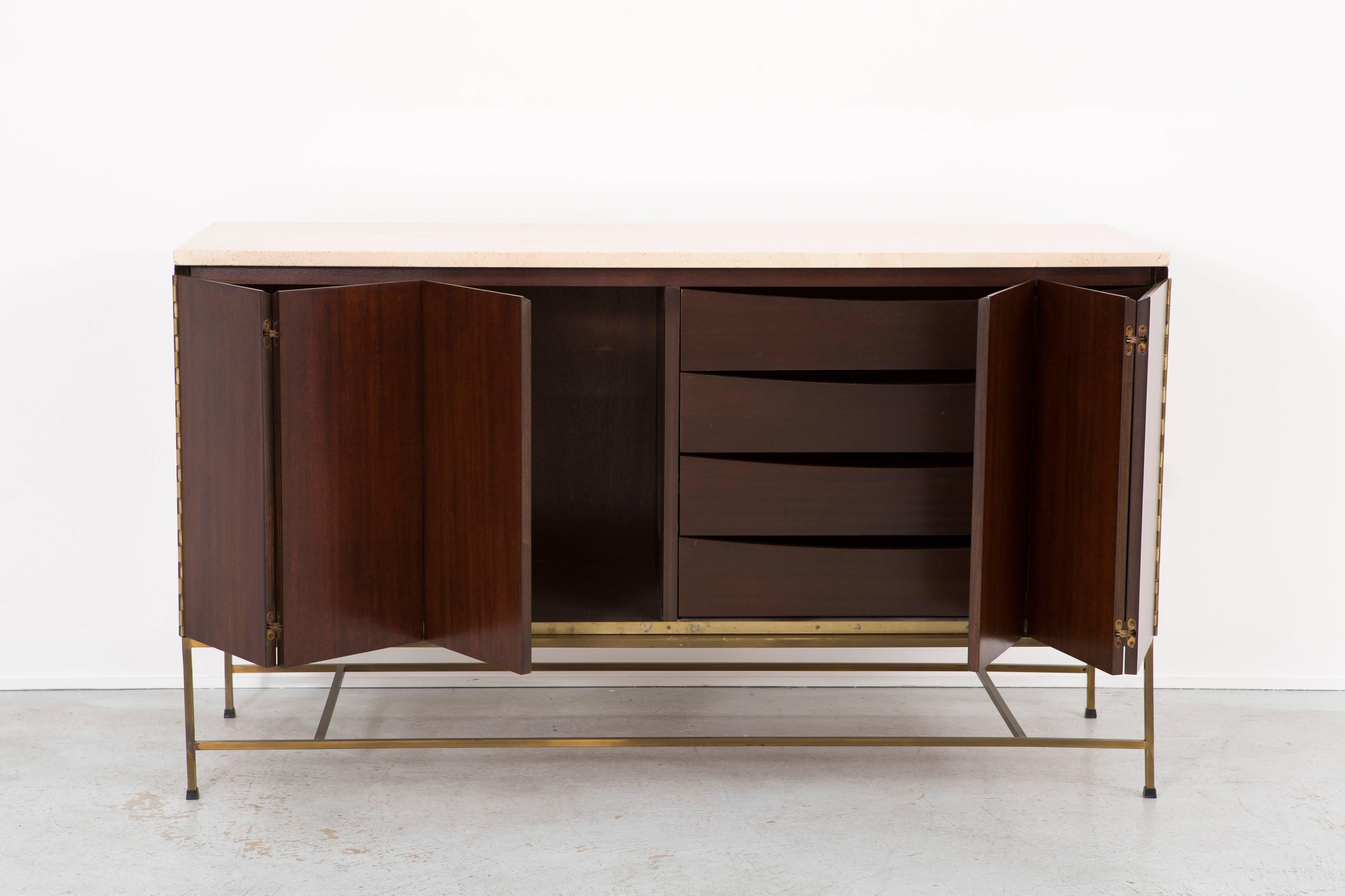 Credenza

designed by Paul McCobb for Calvin

USA, circa 1950s.

Mahogany, brass base and travertine top.

Measures: 30 ¼” H x 60 ½” W x 19” D.

Irwin collection by Paul McCobb.