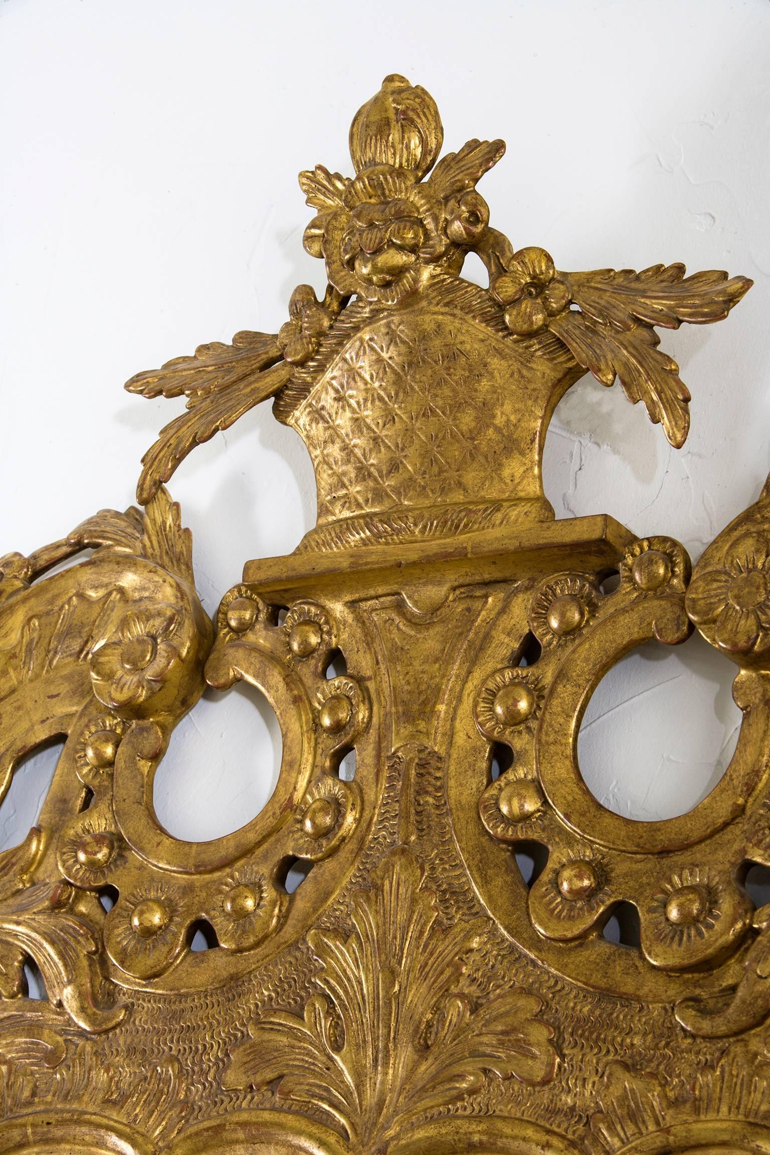 22-karat gold gilt frame with antique mercury mirror.
Size 59 1/4