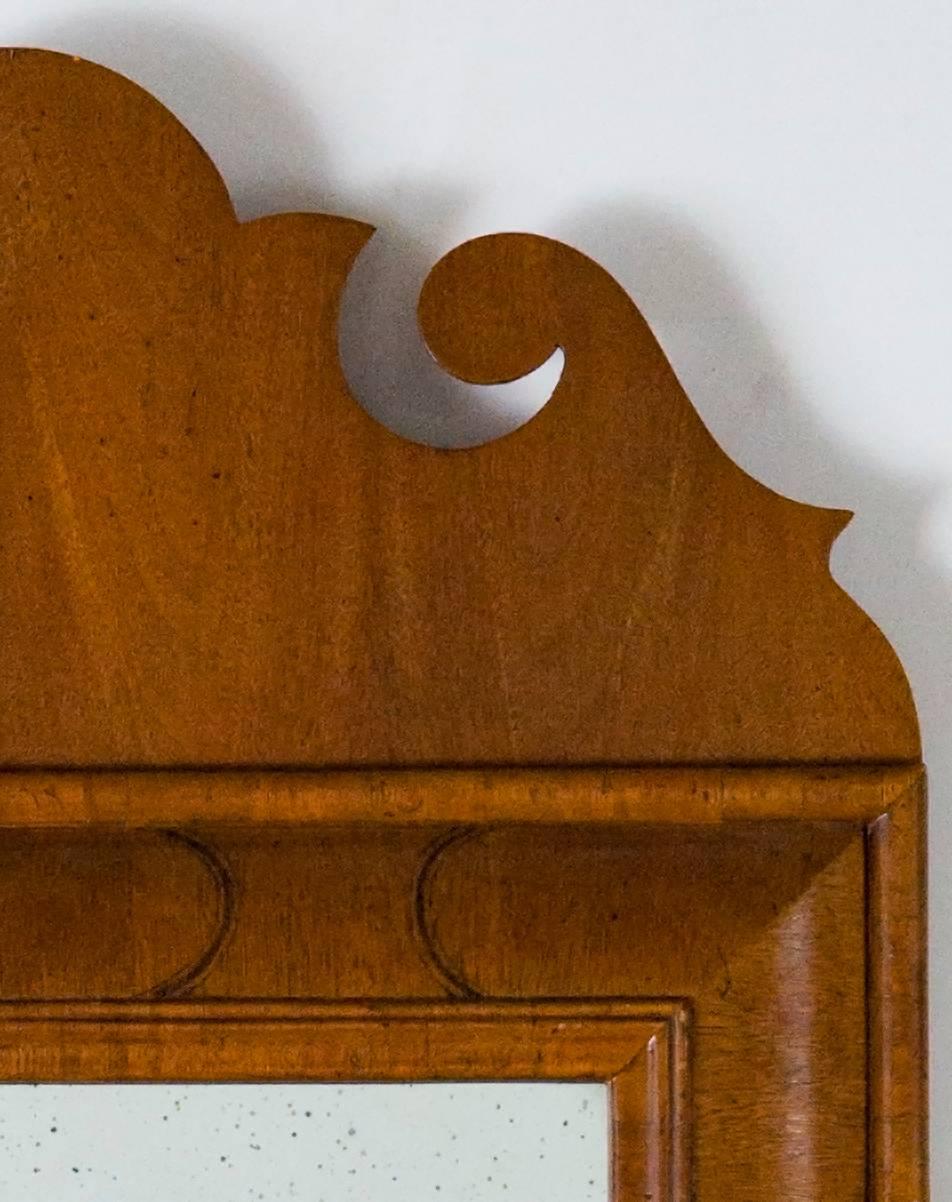 William and Mary mirror style cross banded walnut veneer with thin ebony inlay curved pattern wrapped around border.
One of a kind , Showroom model only
Overall size H. 40