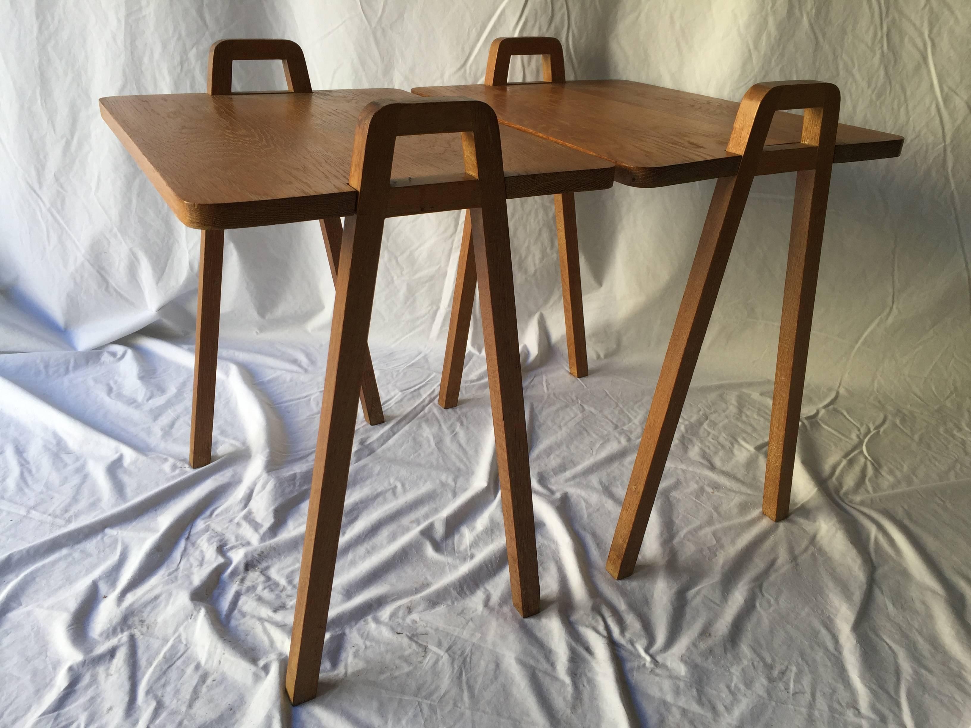Perfect for your Mid-Century decor and your Hungry Man TV dinner. This pair of tray style end tables made of solid oak has removable tops (word to the wise, the tray tops have been screwed on by a block of wood - to my eye this is not original) and
