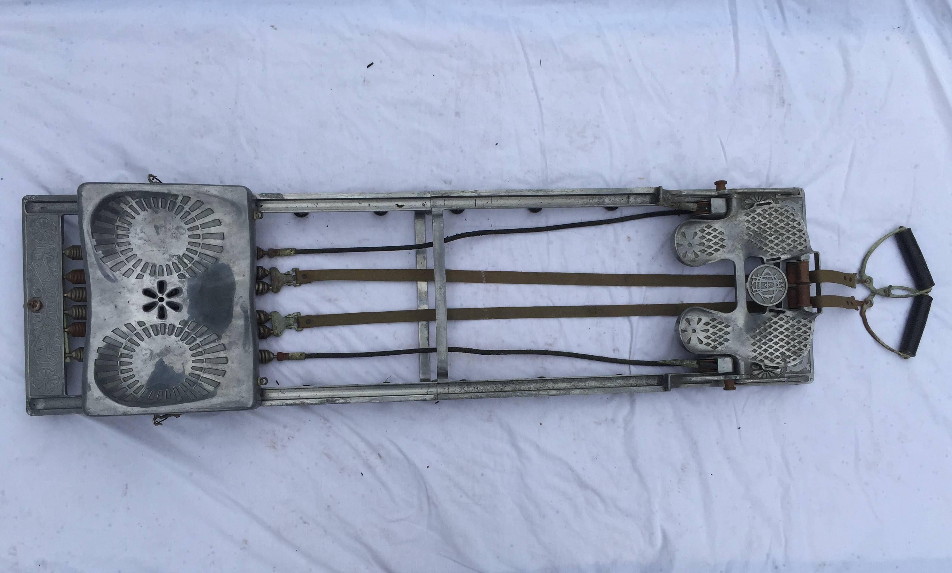 The Health Developing Apparatus Co of Bridgeport, Connecticut created The Seat of Health rowing machine in aluminum with a decidedly Industrial style. This machine dates to the early 20th century, circa 1930s and is in fair to good condition. The