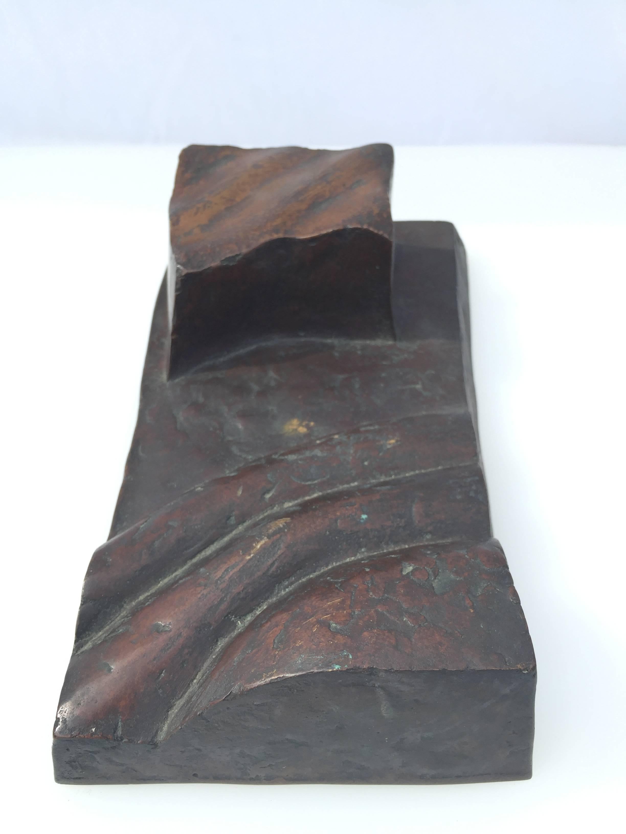 An amazing abstract bronze by German artist Maximilian Hutlett. Signed on the bottom, Hutlett 1983 2/10 Casting Room Cave and on a piece of tape See Stick III 2/10. 

From the Maximilian Hutlett catalog: 
Maximilian Hutlett. 
Plastic signs and