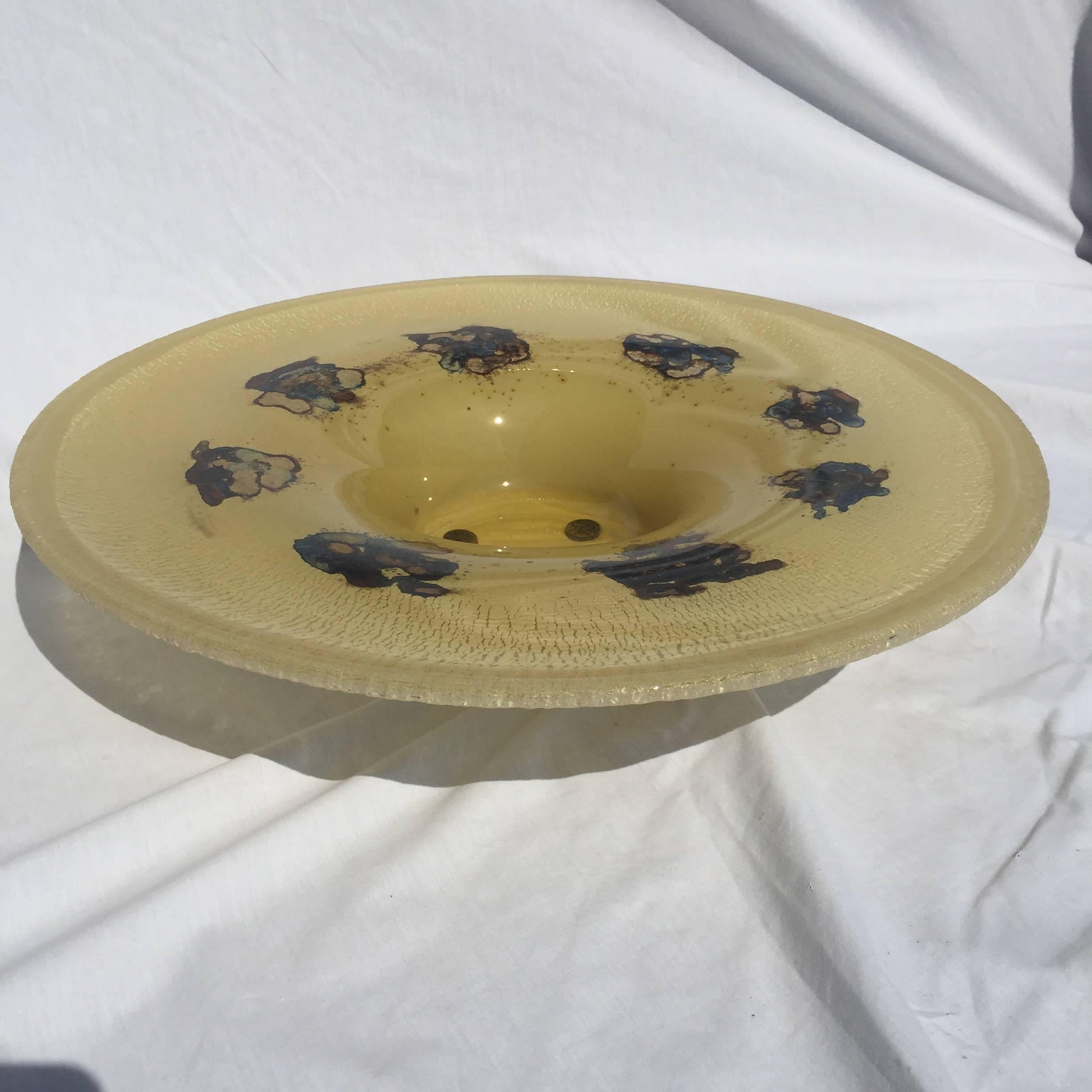 A wonderfully large Murano glass bowl using the Scavo technique signed Barbini Murano. The wide flange (about 7.25 inches) is decorated with a recognizable design in chocolate brown and electric blue. The rim and underside exhibit the Scavo