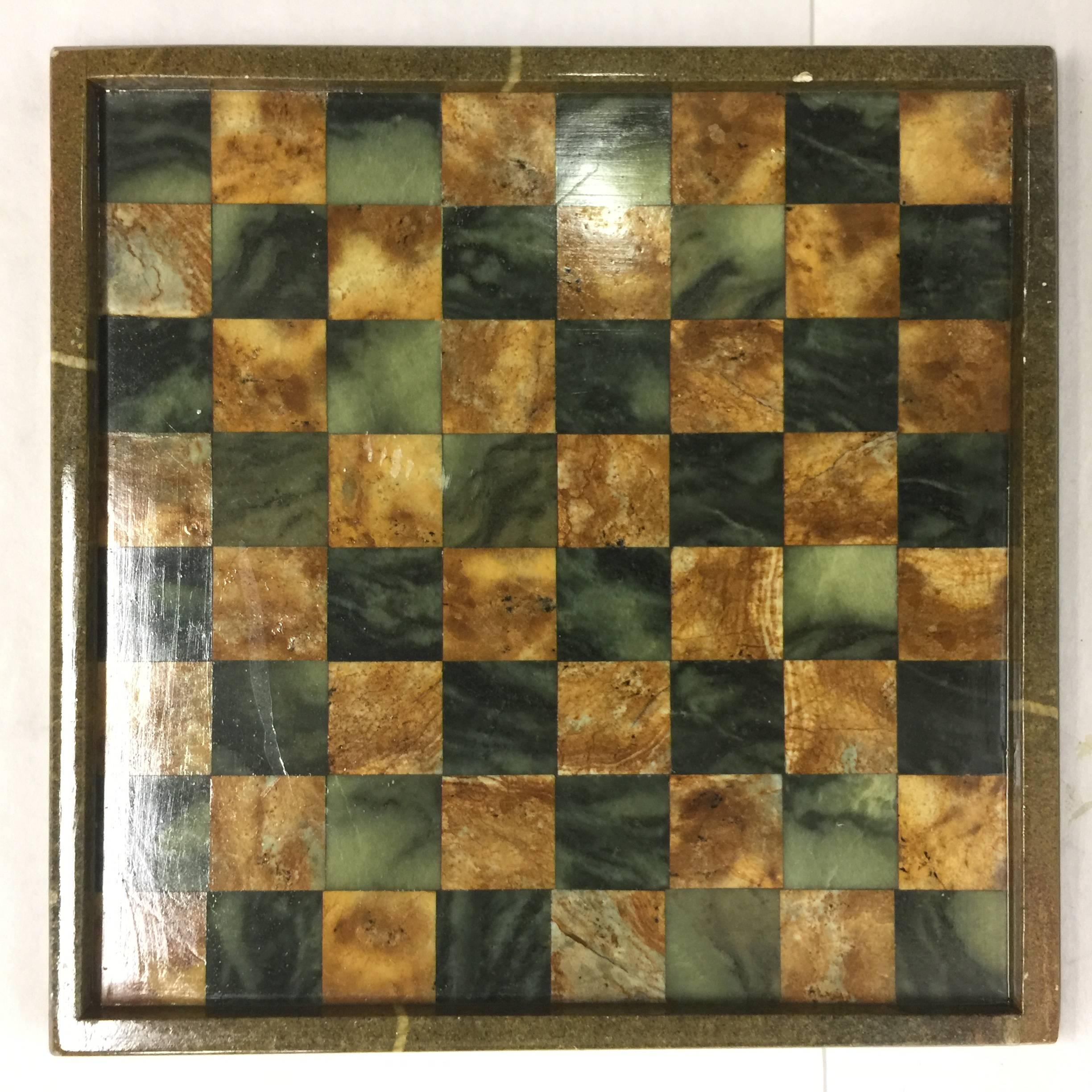 Game on! This vintage Brazilian chess or checkers game board is a mix of different marbles. Gorgeous!