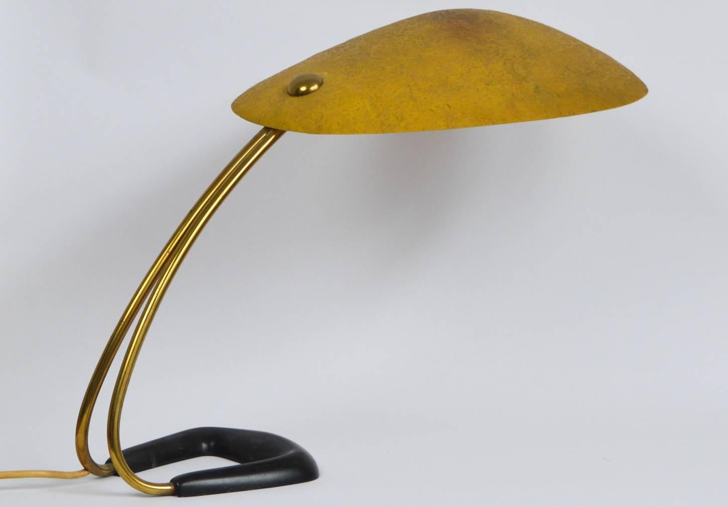 Stunning table lamp, 1950s, Vienna, Austria. Nice minimalistic lamp composed of a black lacquered metal foot with double tubular brass structure and yellow tainted fiberglass diffuser.
 
The lamp is in good original vintage condition consistent with