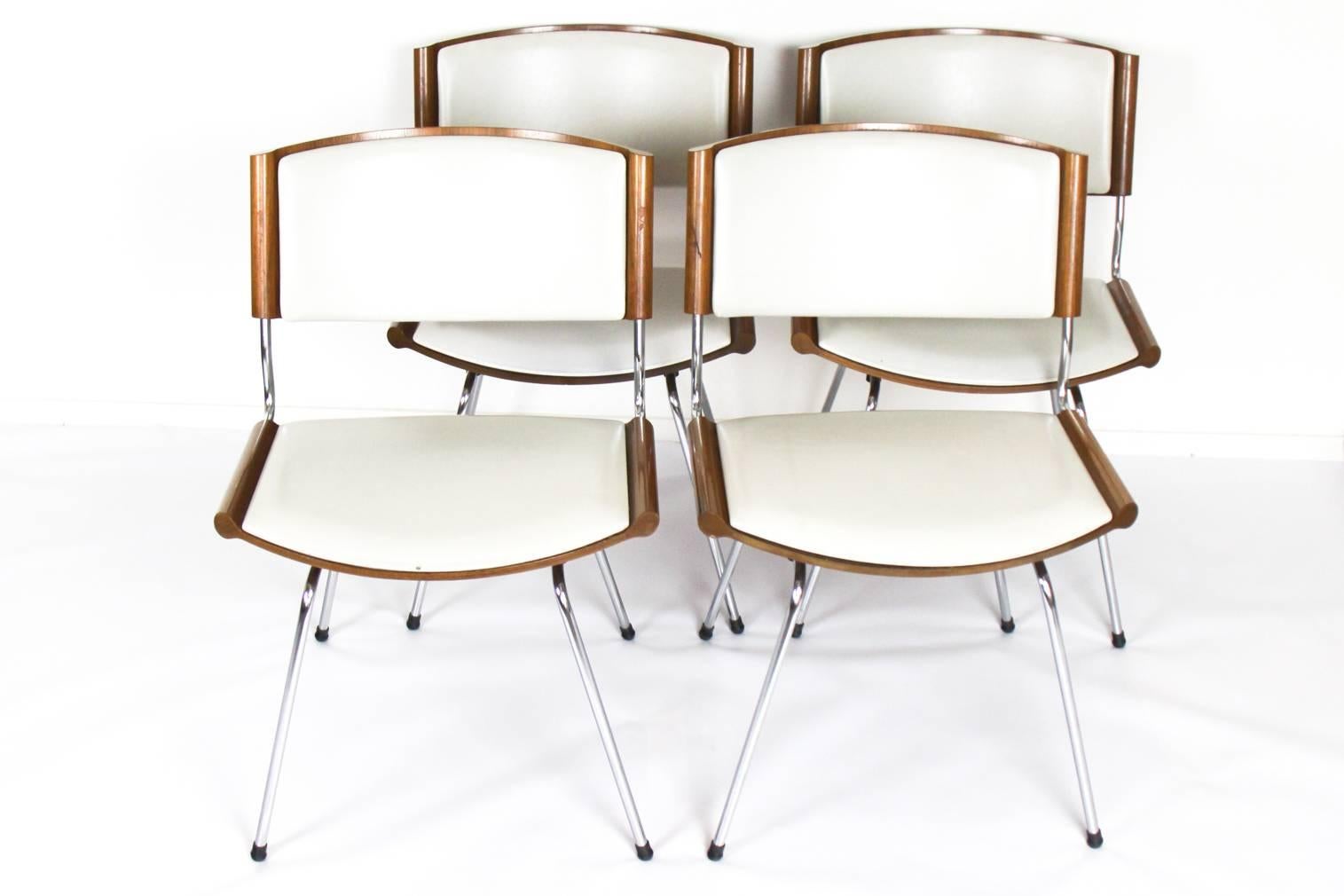 Set of four dining chairs, in metal, wood and faux-leather by Nanna & Jørgen Ditzel for Kolds Savvaerk, Denmark, 1958. Model 150, also called 'Badminton' chair due to the end of the backrest and seats which has been inspired by the of the
