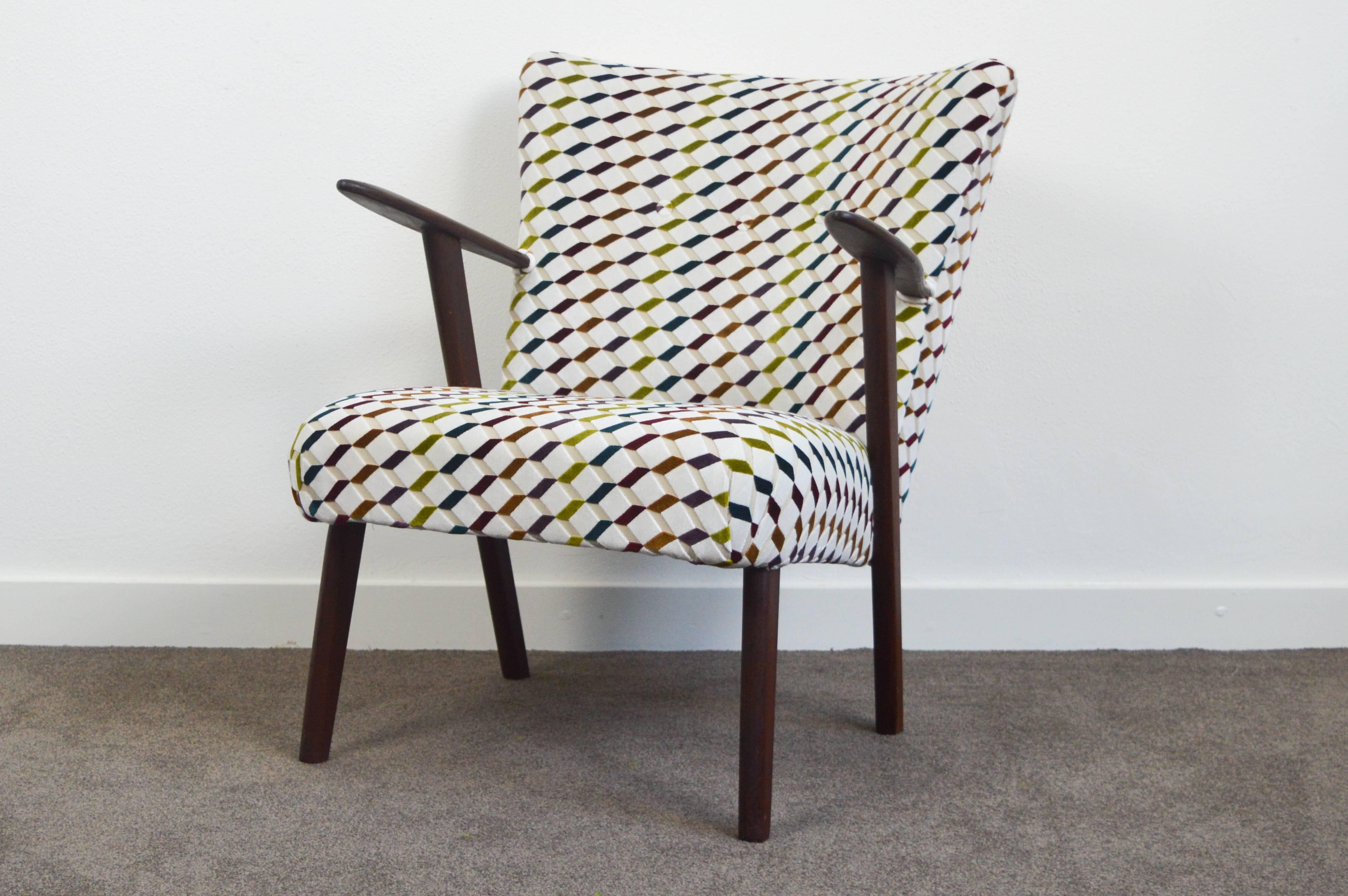 A powerful designed vintage Danish club chair, re-upholstered with a beautiful fabric with graphic design. Cigar shaped armrests and legs are made of rosewood. A lovely club chair with a beautiful minimalistic design, a bit in the style of Kurt
