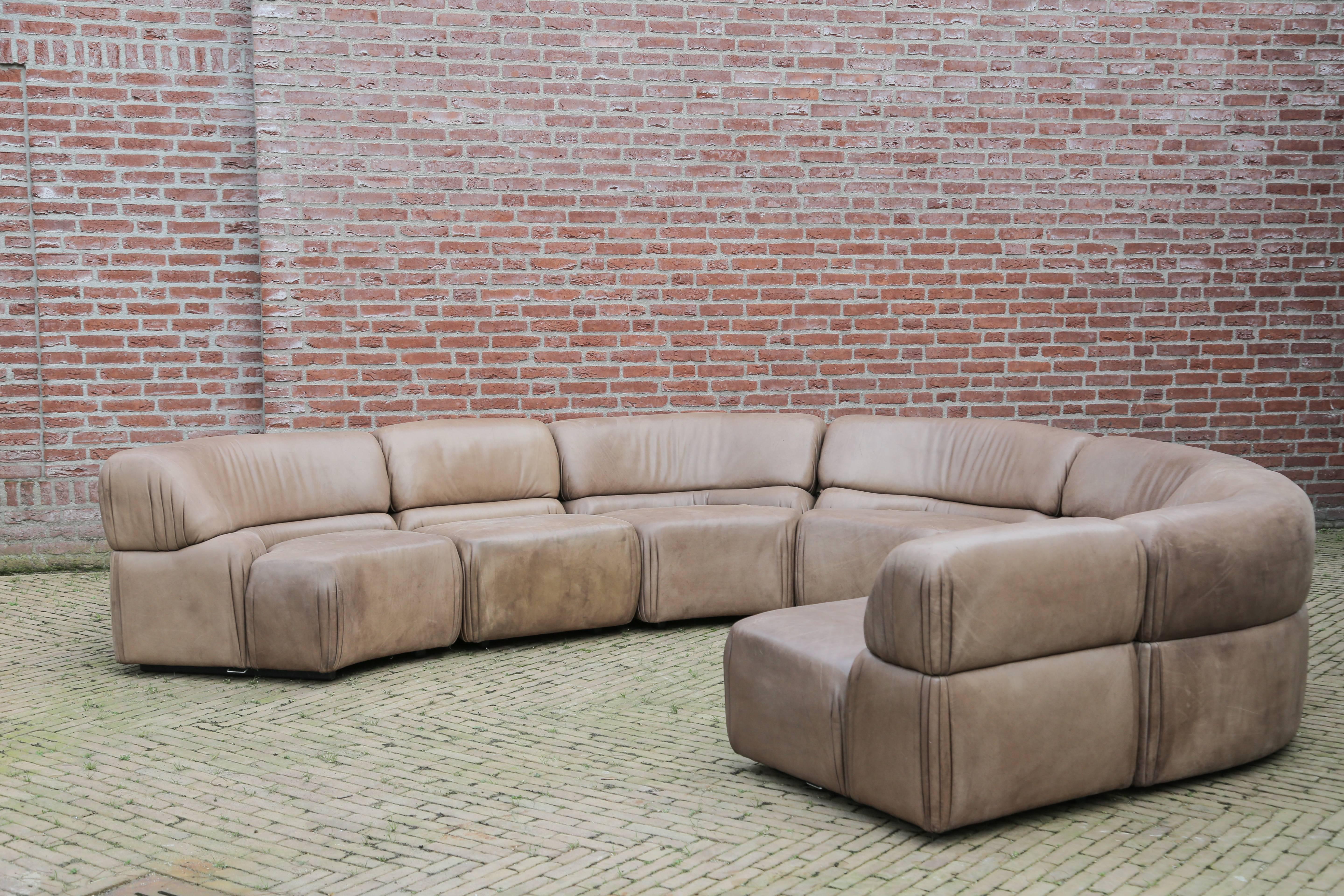 Fantastic modular sofa by De Sede. Very rare model called Cosmos,
medium brown buffalo leather with patina to the surface.

Manufacturer: De Sede.
Type: Cosmos sofa.
Year: 1970.
Country: Switzerland.
Materials: Buffalo leather.
Condition: