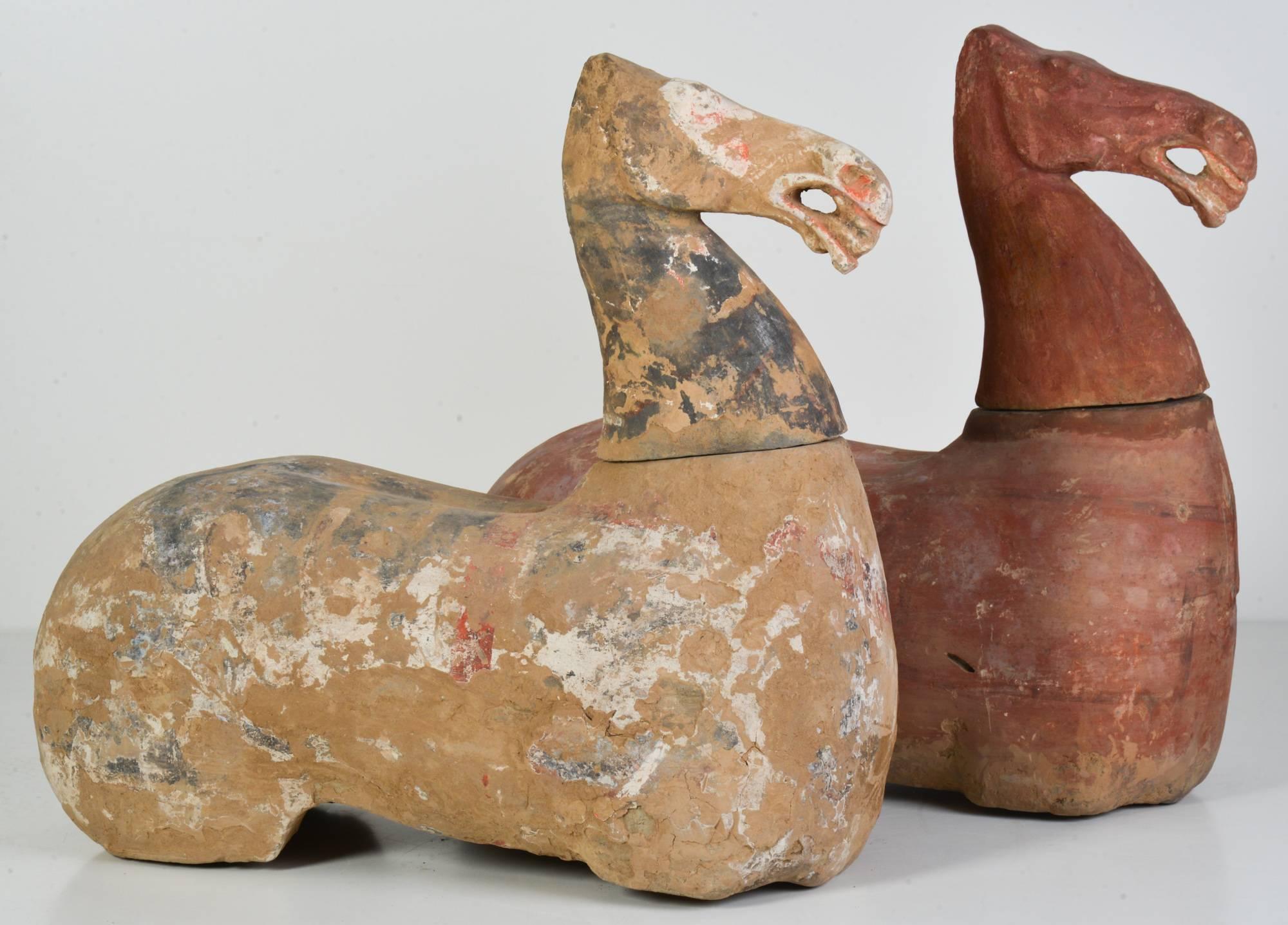 Imposing large pair of excavated original terracotta horses of the Han dynasty (206 B.C.-220 A.D.), retaining much of the original pigment. Artifacts were buried for thousands of years and then unearthed, which helped to naturally preserve the