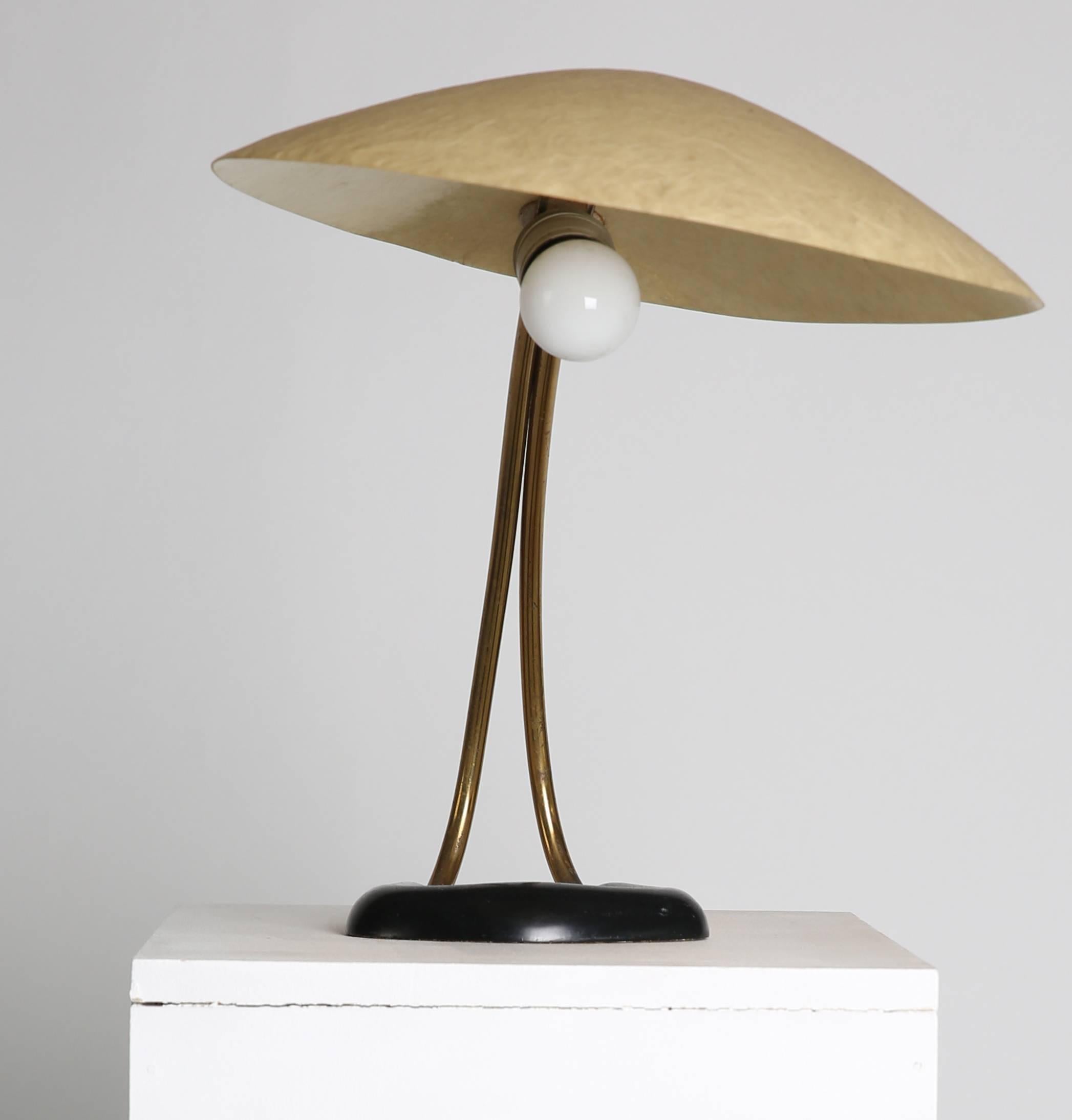lamps by designer Carl Auböck in 1950s, Vienna, Austria. Nice minimalistic lamp composed of a black lacquered metal foot with double tubular brass structure and yellow tainted fiberglass diffuser.

Measurements: Total height ca. 38 cm, total