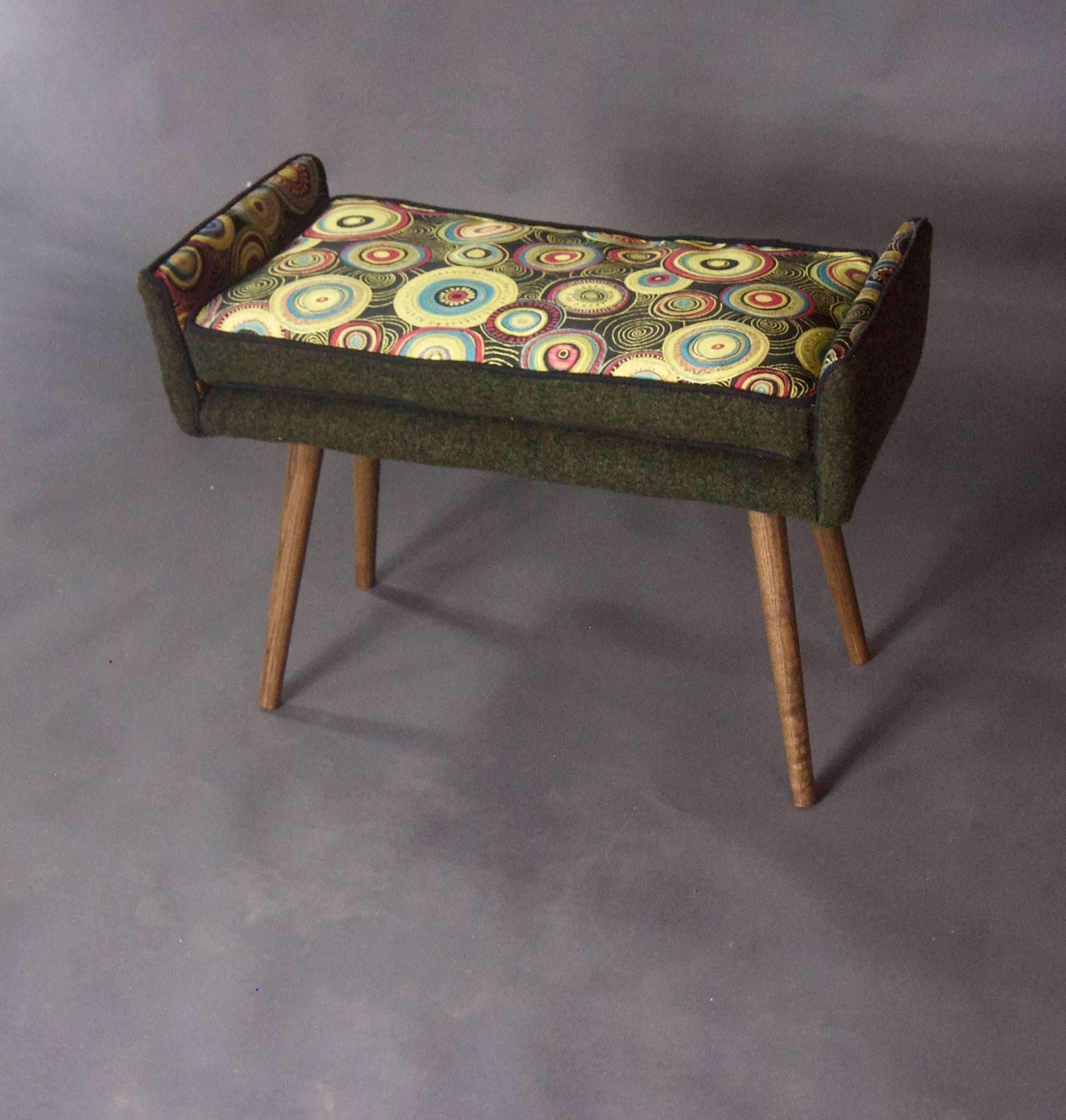This vanity-sized stool will add a dash of color and personality (not to mention an additional seat) to any room. Picture it under a window, in a corner, at the end of a hall.

This stool is leggy and is dressed in a sunburst pattern with a forest