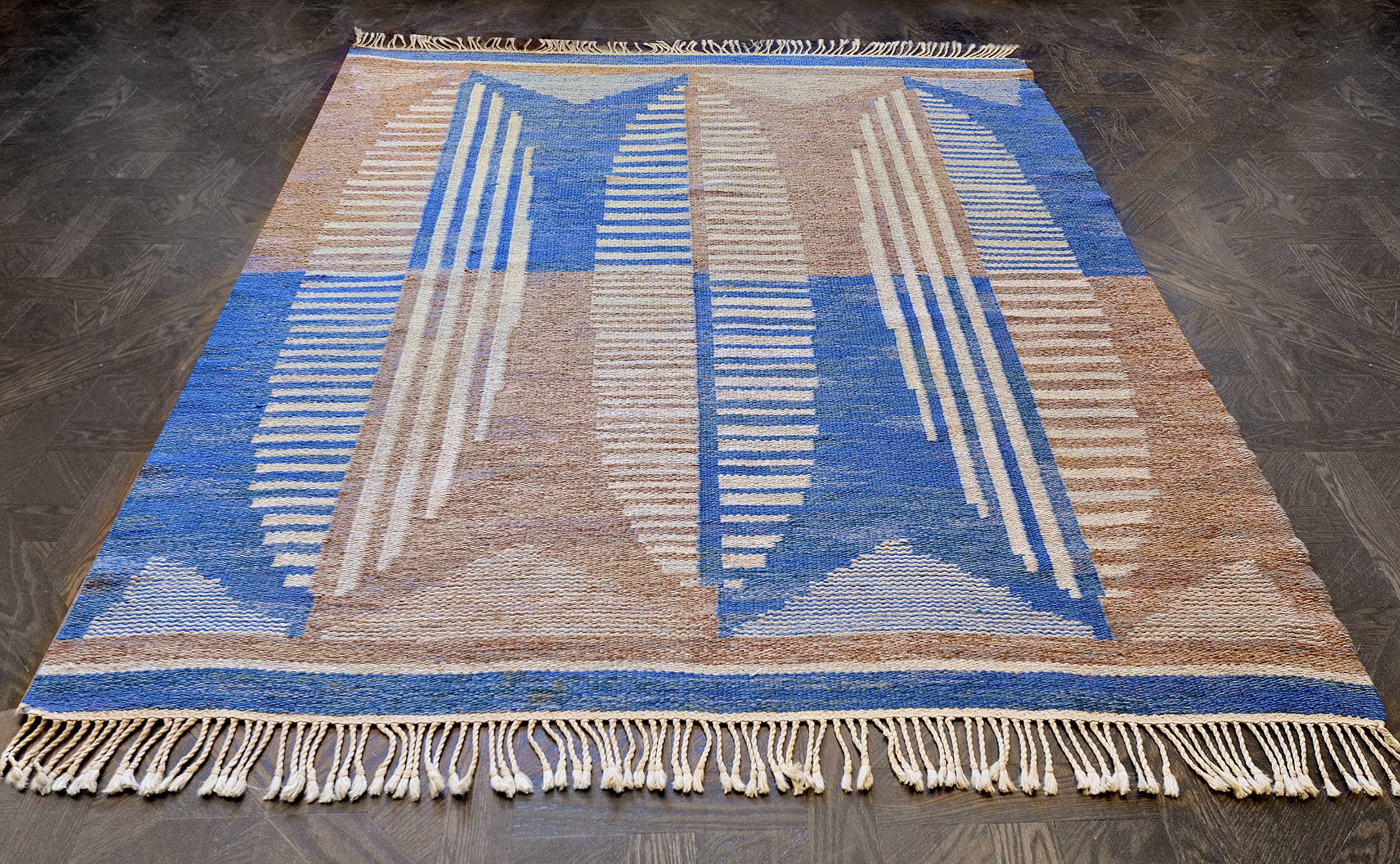 This vintage handwoven Swedish Deco rug has a checkered field of broad refined sapphire and shaded almond-brown cells overlaid by broad oblong lozenges of parallel and perpendicular rectangle motif, plain opposing sapphire stripes.