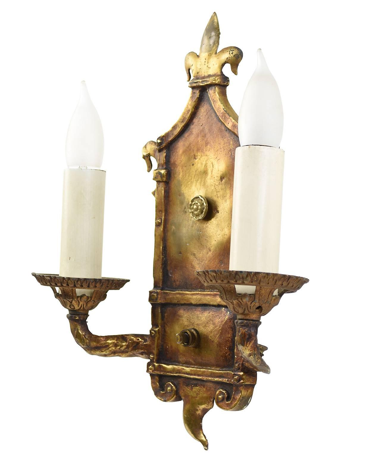 This set of four sconces feature fine metal work and a perfect antique patina. Each sconce is signed M. Leonard, BBW.

We find that early antique lighting was designed as objects of art and we treat each fixture with careful attention to preserve