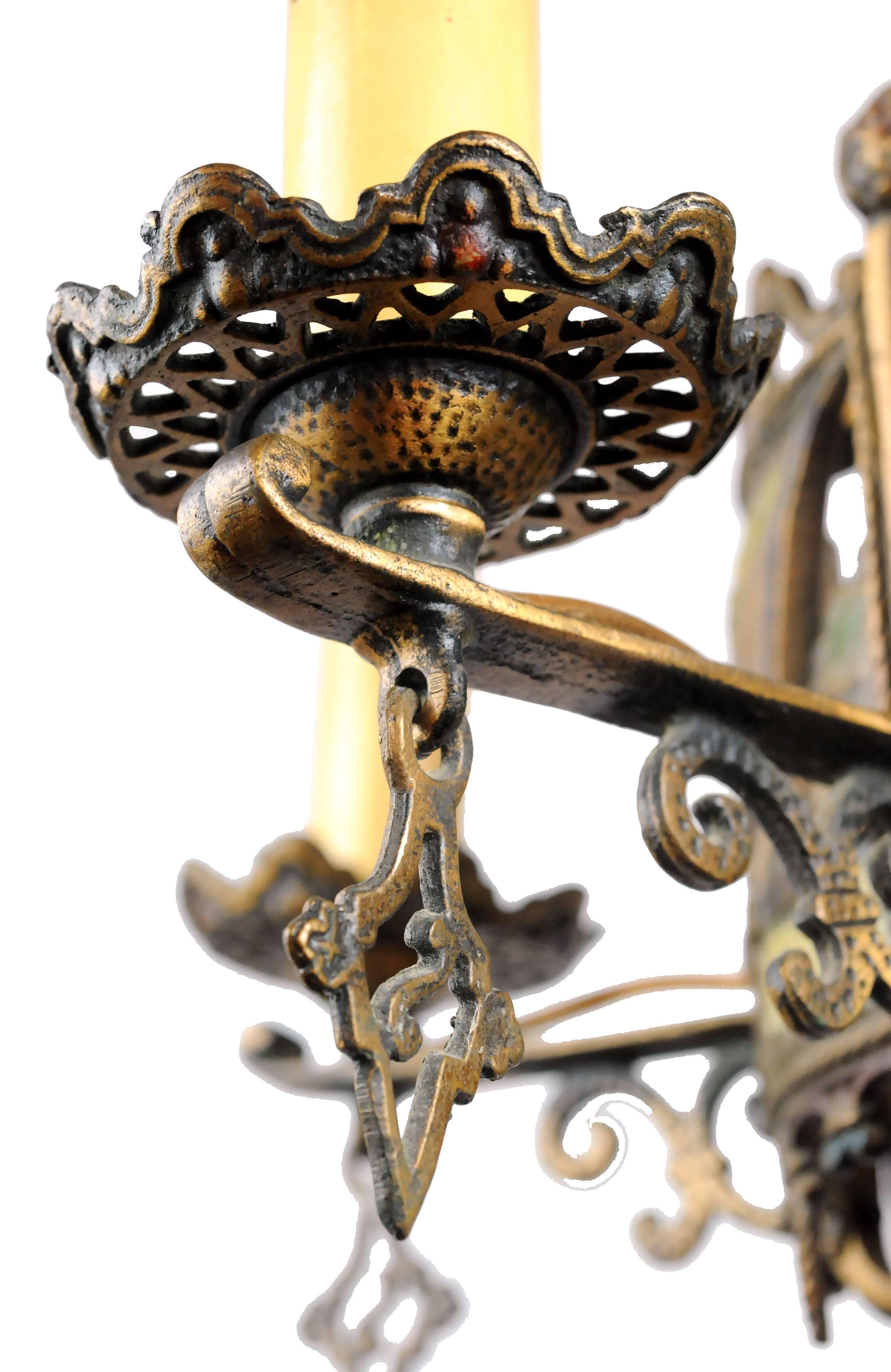 This stunning cast bronze five-light chandelier with nautical imagery is overflowing with intricate details. Subtle, yet colorful hues embellish the canopy, candleholders and ship imagery. Additionally, textural details abound in every nook and