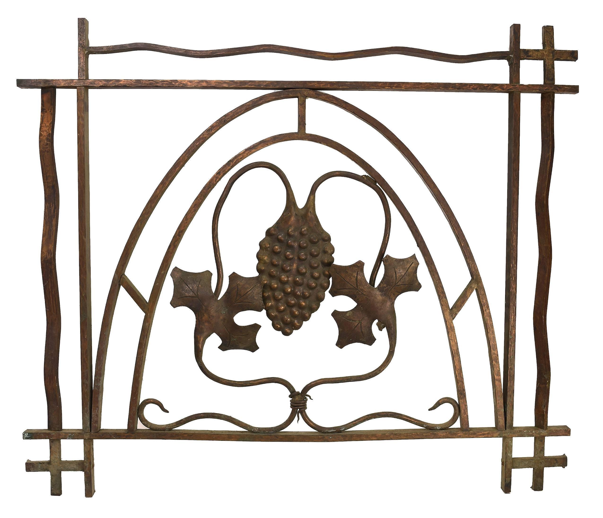 These beautiful cast bronze bank teller gates are embellished with stylized grape leaf designs centered within an attractive arch. Used as a garden ornament, or as an overlaying window panel, these gates could serve multiple purposes with grace and