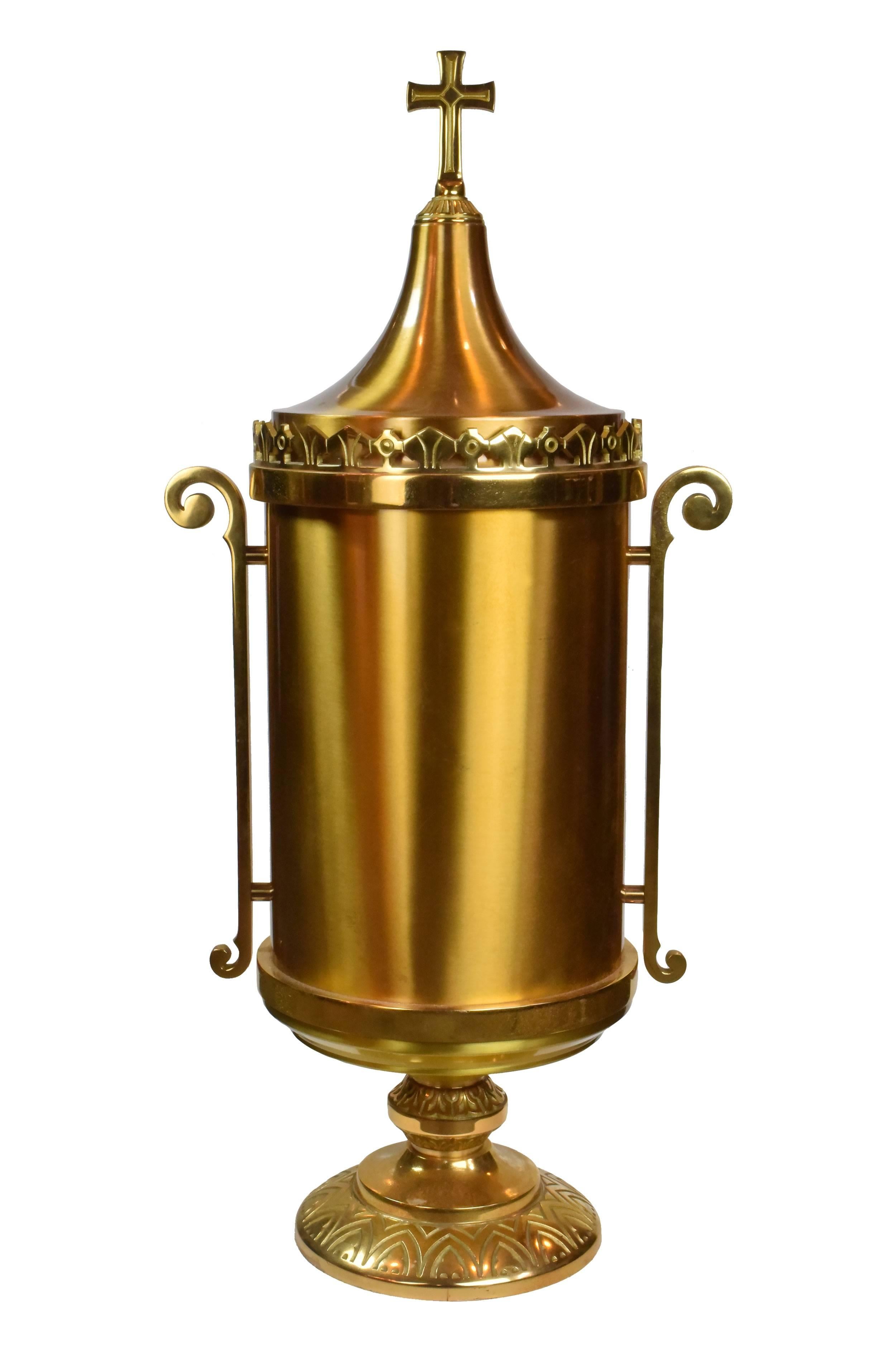 This dazzling tabernacle was once used to store the Eucharist in one of Minneapolis' oldest churches. A heavy, substantial piece, it features a large cross surrounded by a sunburst design radiating outwards. Additional stylized embellishments adorn