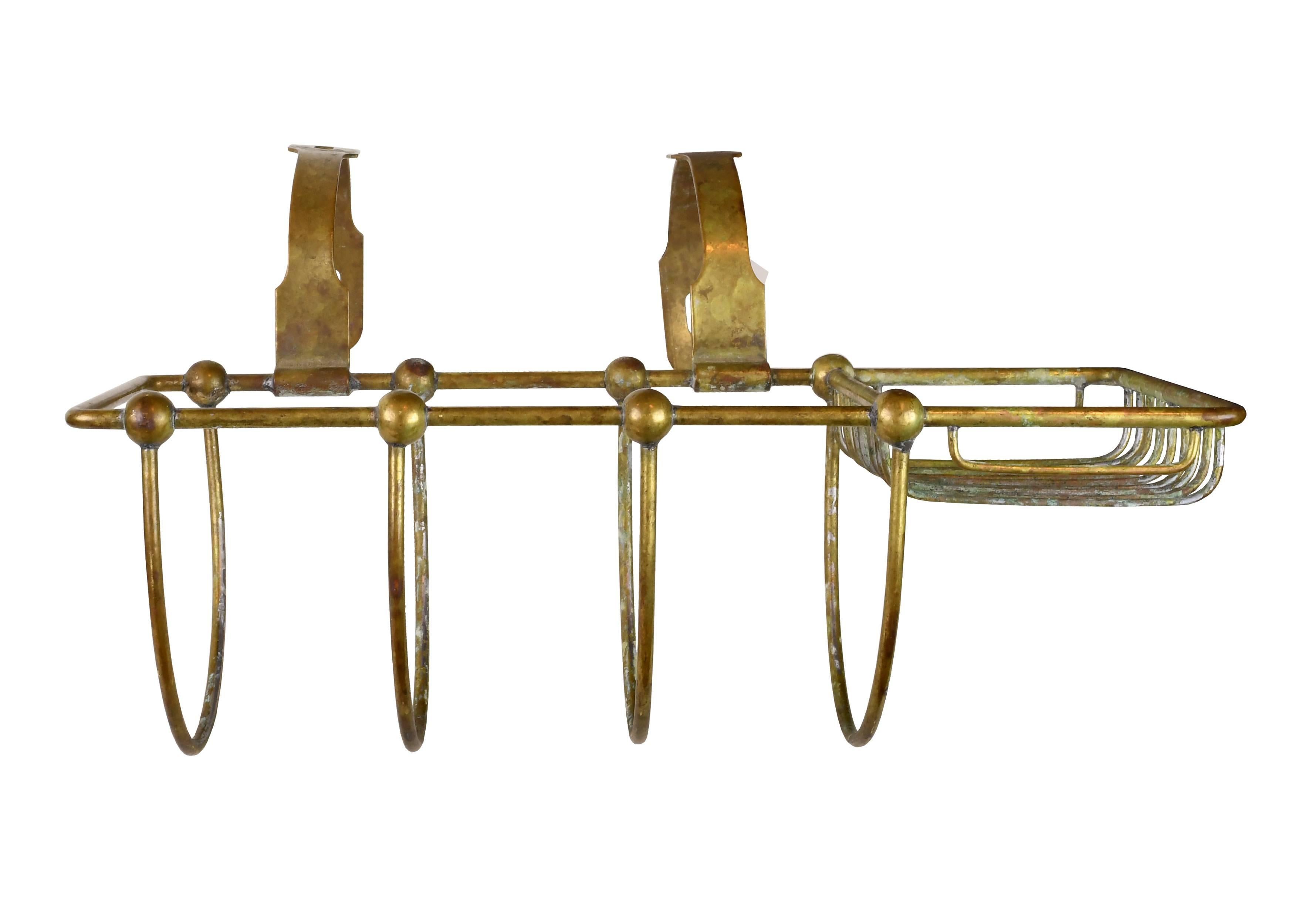 This fantastic brass soap holder mounts to the side of the tub and features two separate slots for sponges, soap, loofahs, and other small cleaning implements. An imprint on the bottom marks the patent date as February 6, 1900. A healthy dose of