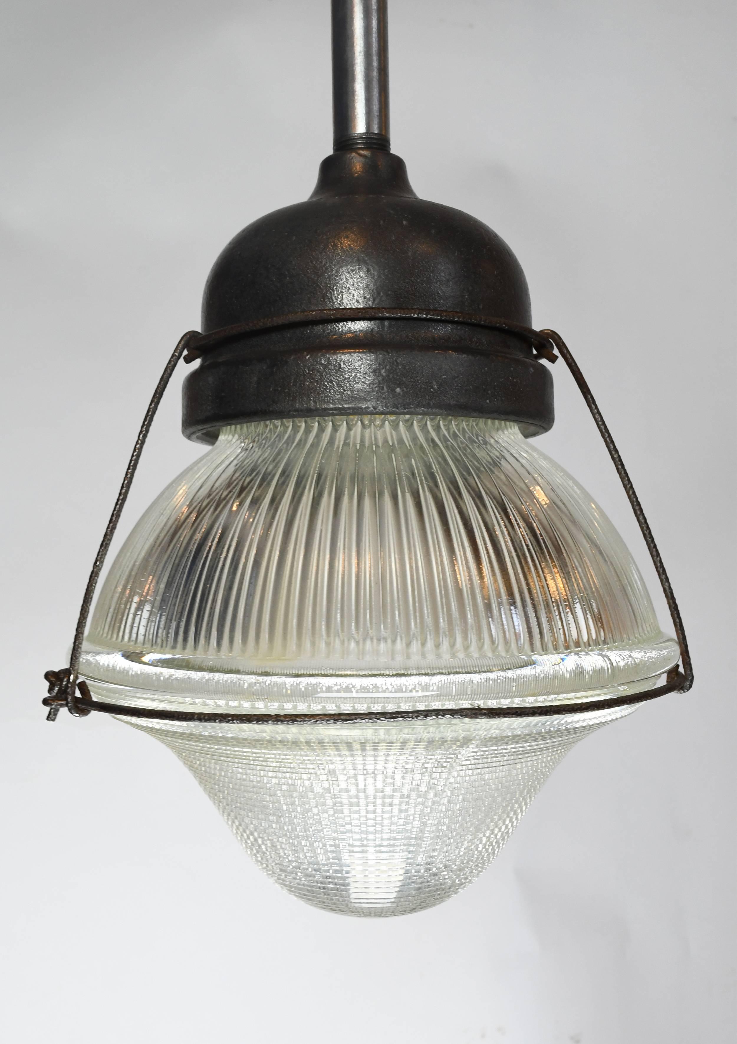 This Holophane acorn pendant is decorated with textured glass and cage around the glass. It will give a clean Industrial look to your space.


We find that early antique lighting was designed as objects of art and we treat each fixture with