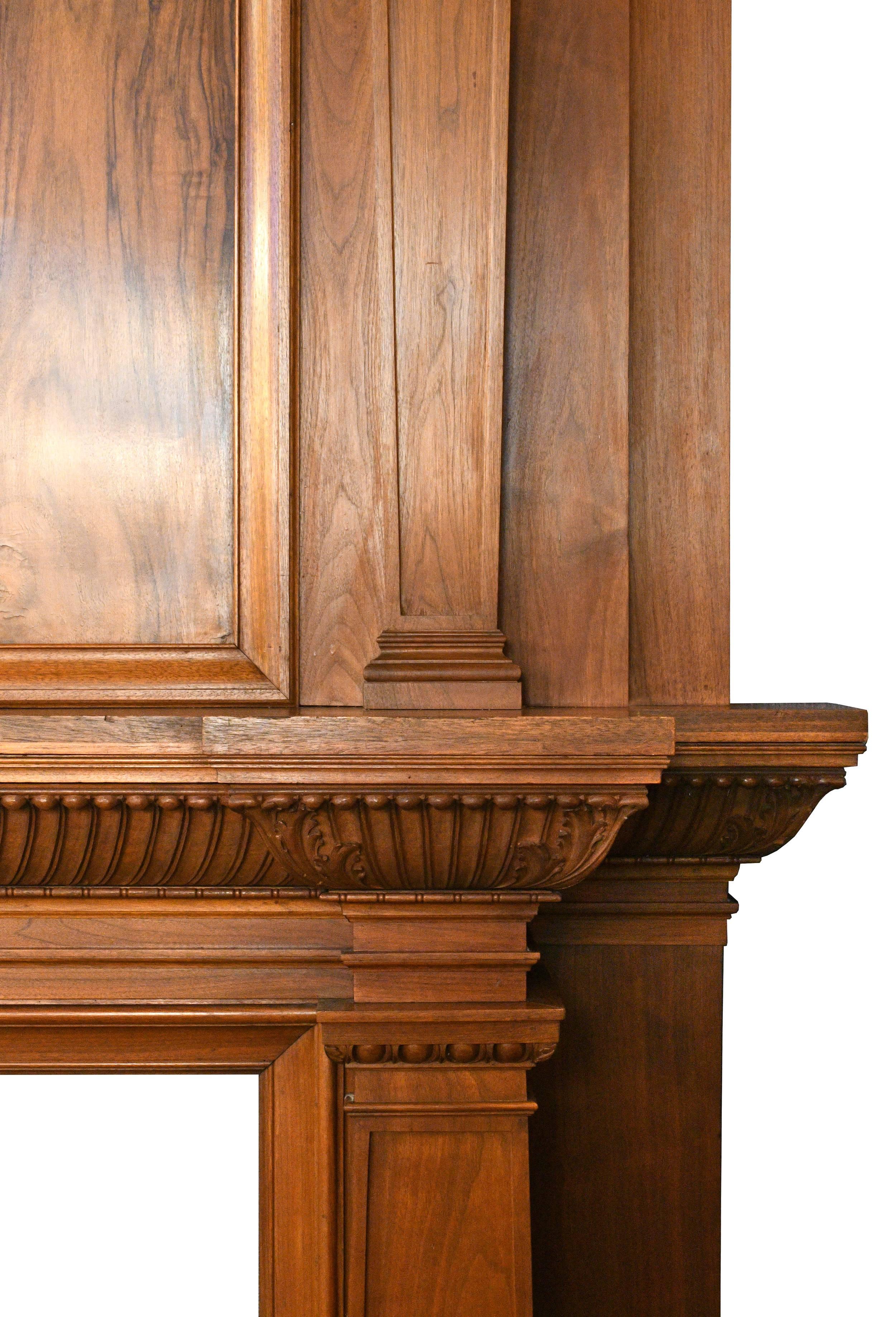 This beautiful over-sized mantel is made of burled walnut, sought after by craftsmen for its unique shapes and ring patterns. These particular patterns are more or less symmetrical, reminiscent of ink blots in a Rorschach test. The extremely
