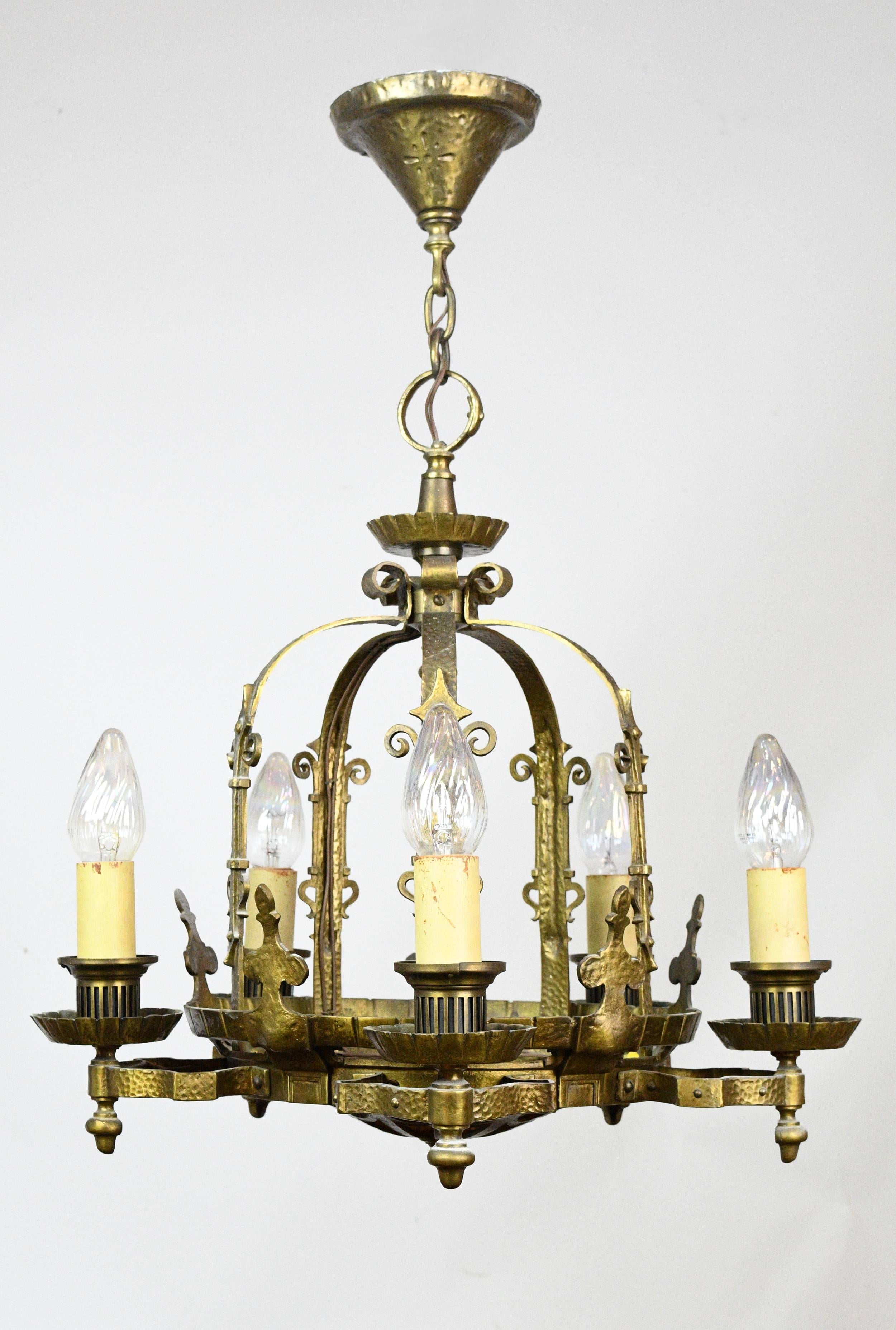 This is a beautiful five-light chandelier influenced by the Gothic Revival movement and design style. What makes this stunning chandelier even more special is it's mica shade/bowl on the bottom. Having the light shining through the mica shade is