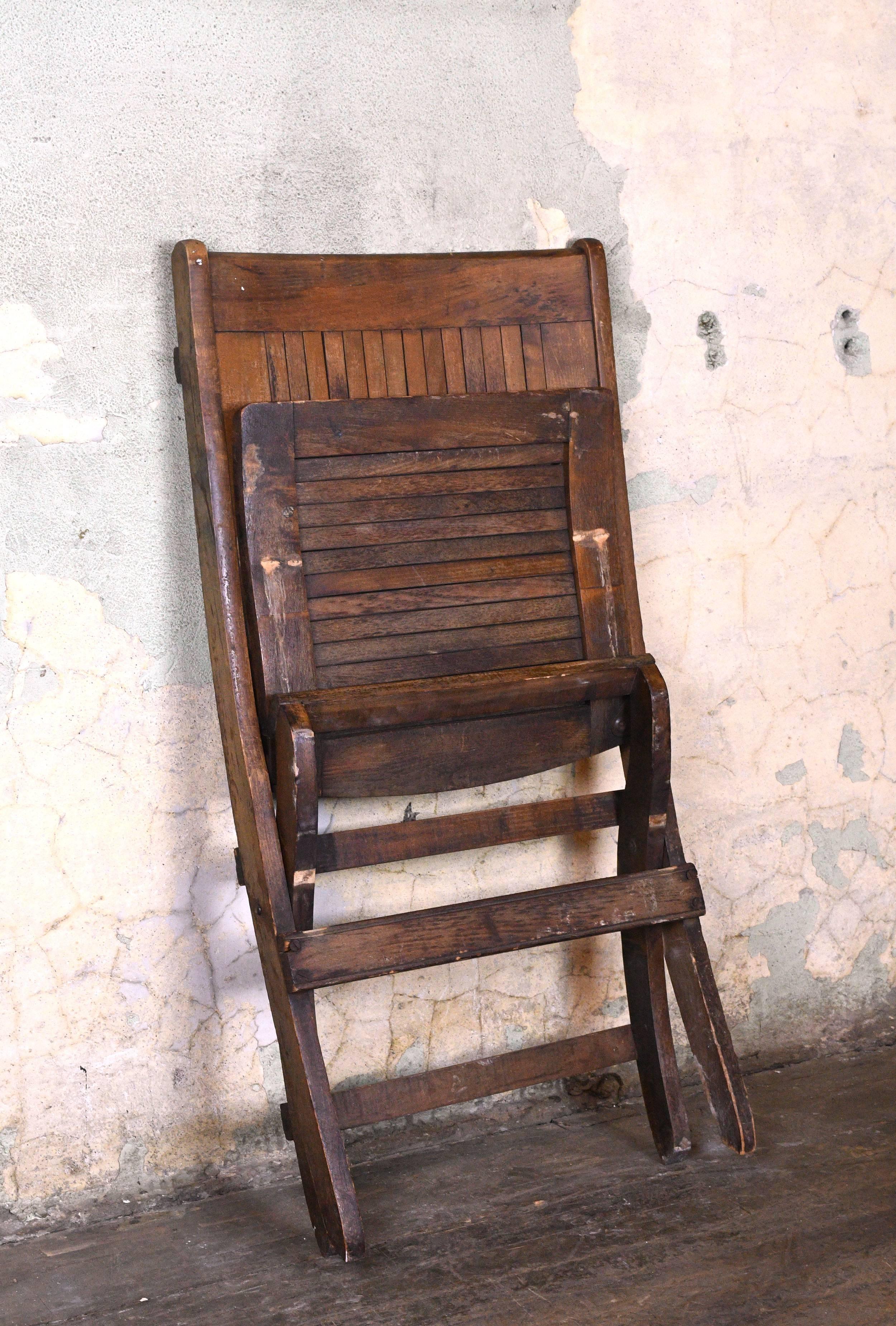 Built to last, these solid walnut folding chairs are comfortable, handsome, and practical. They have earned their patina and are the perfect rustic accent piece for any decor. See the matching double folding chairs here.
   

Circa: 1920
Condition: