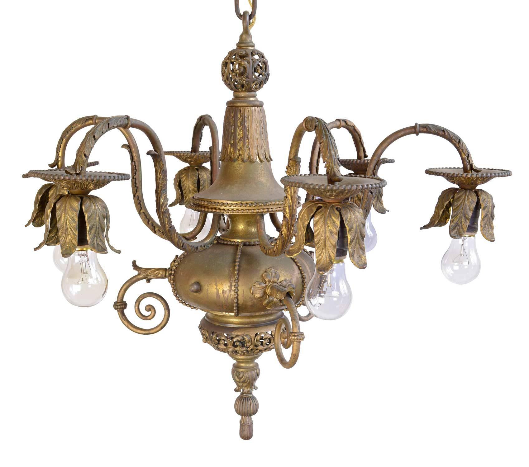 This intricate Victorian-era fixture in cast brass and silver plate has ornate filigree patterns, beading, and heavy cast arms with leaves and scroll work. The fixture's six lights provide generous light and an elegant touch to a room. The fixture