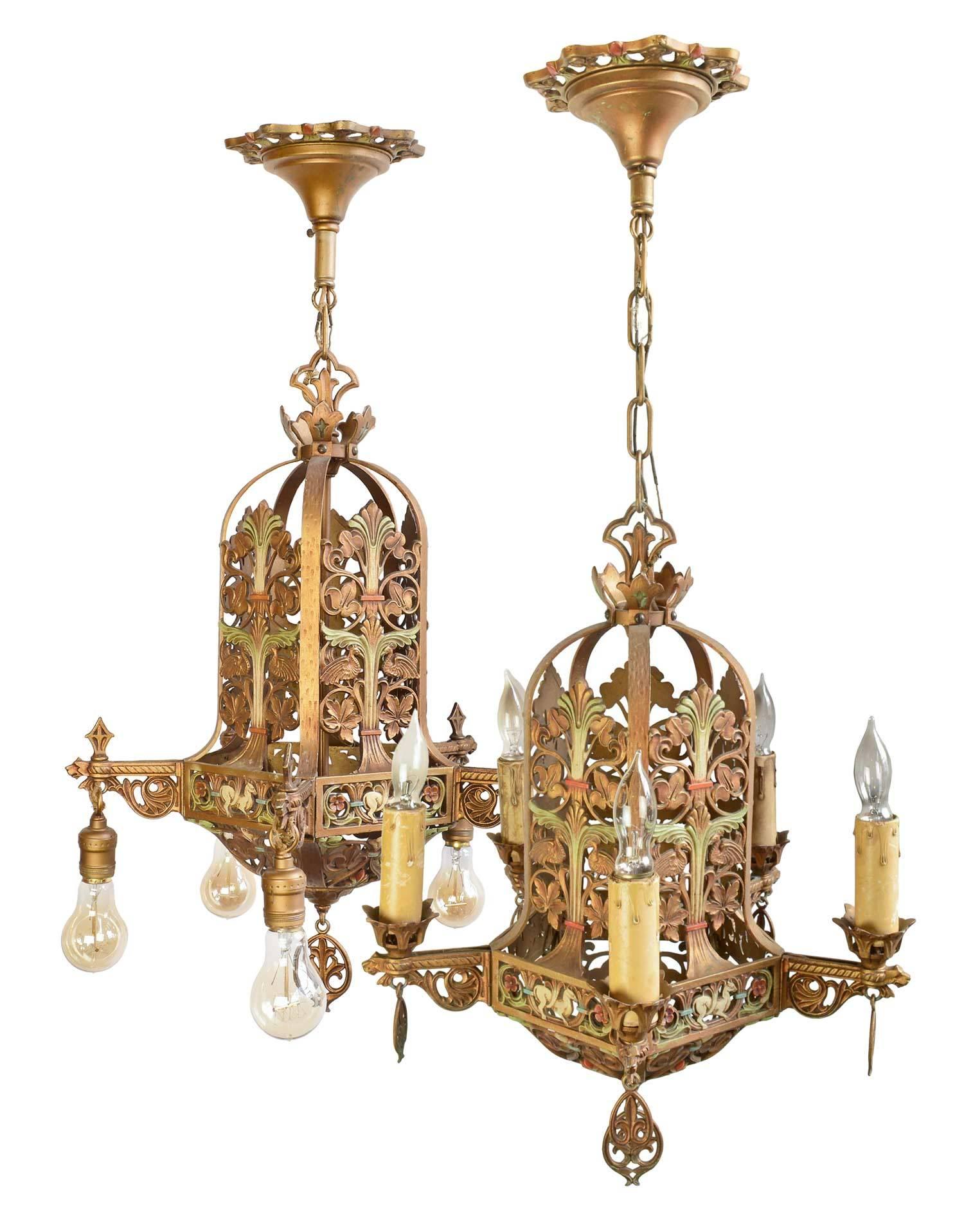 Entire suite of matching decorative polychrome fixtures with deco floral and leaf detail throughout, featuring fleur-de-lis, lion, goat and bird emblems.

Includes pendant, pair of sconces, and two five-light chandeliers.