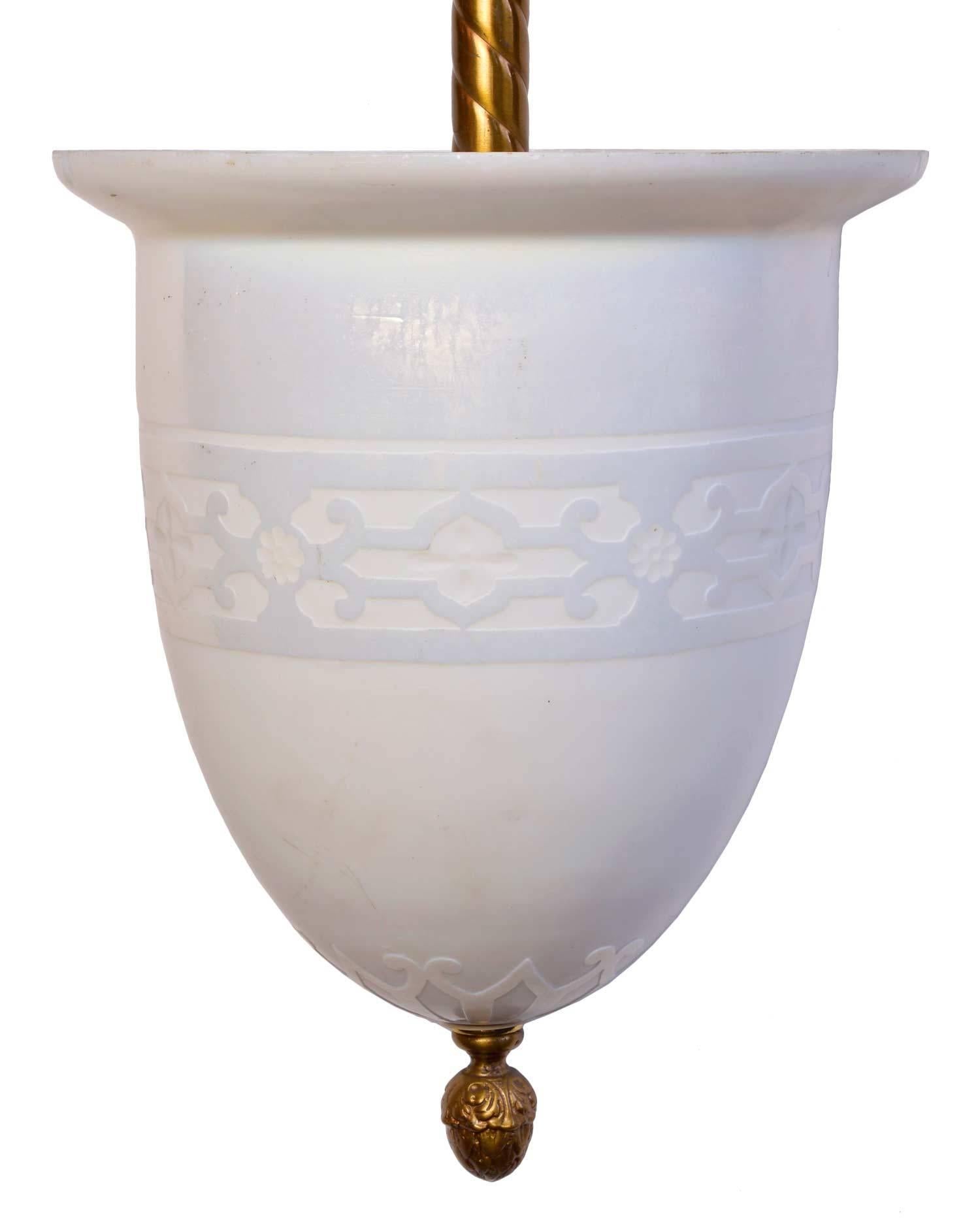 This etched pendant was made circa 1920 with a lovely classic motif and cast brass fitting.

We find that early antique lighting was designed as objects of art and we treat each fixture with careful attention to preserve original beauty. Our