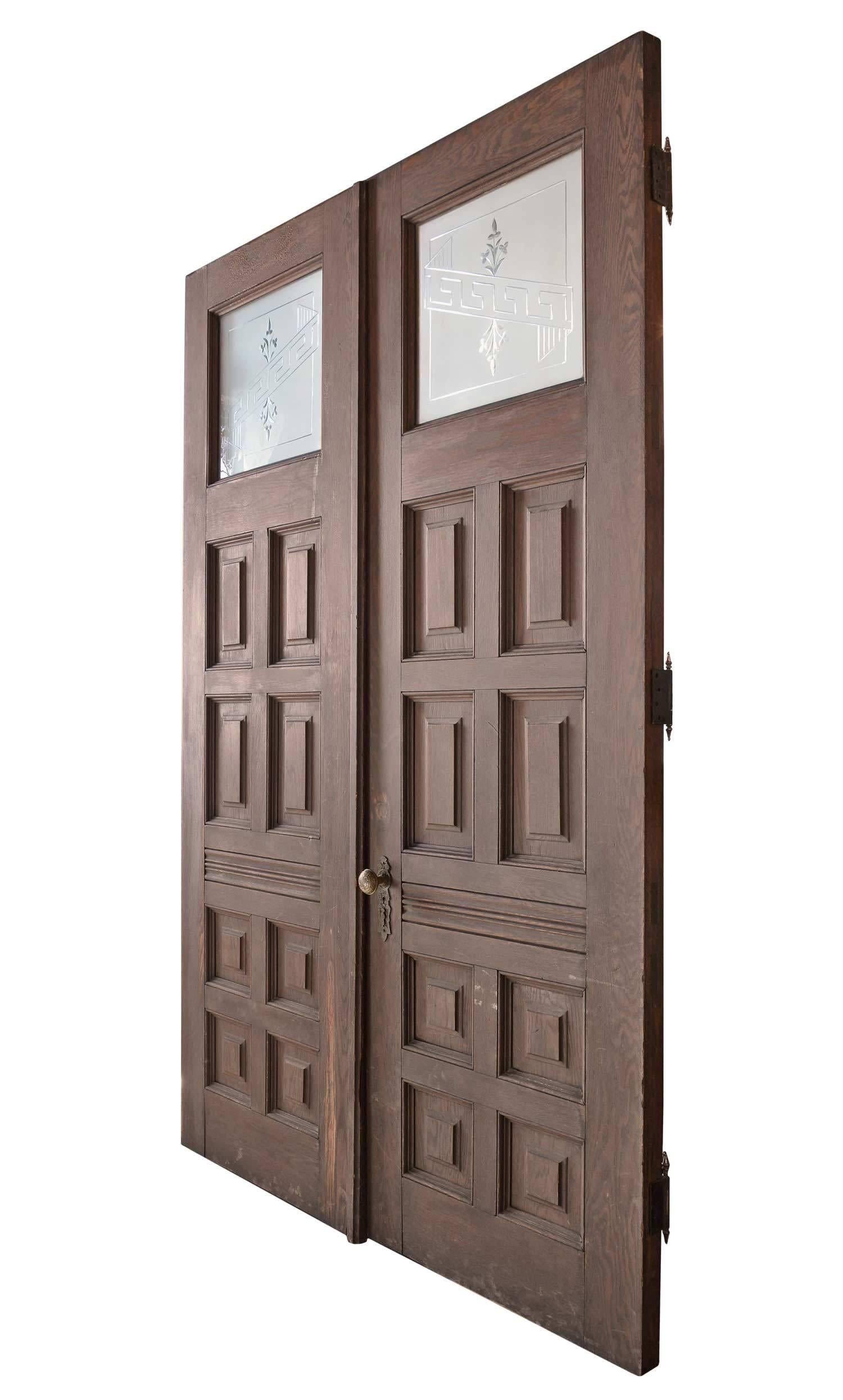 Saved from an 1870s home in Lacrosse, Wisconsin, this pair of doors have stood the test of time. Grand in scale and size, each door is 30" wide x 94" tall. Both the exterior and interior sides retain their original finish. The exterior oak