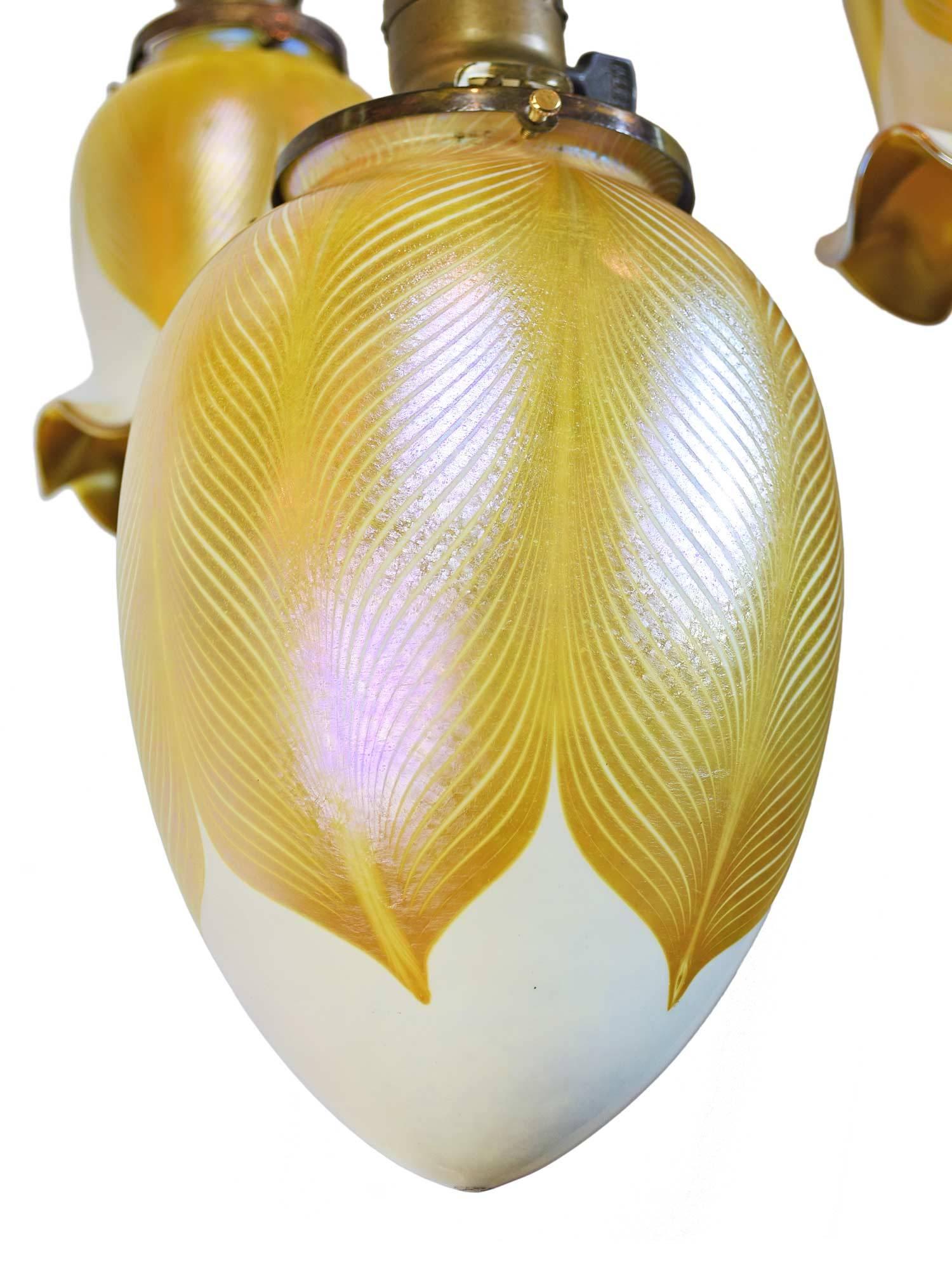 American Craftsman Stunning Set of Pulled Feather Quezal Shades on Cast Brass Pan Fixture
