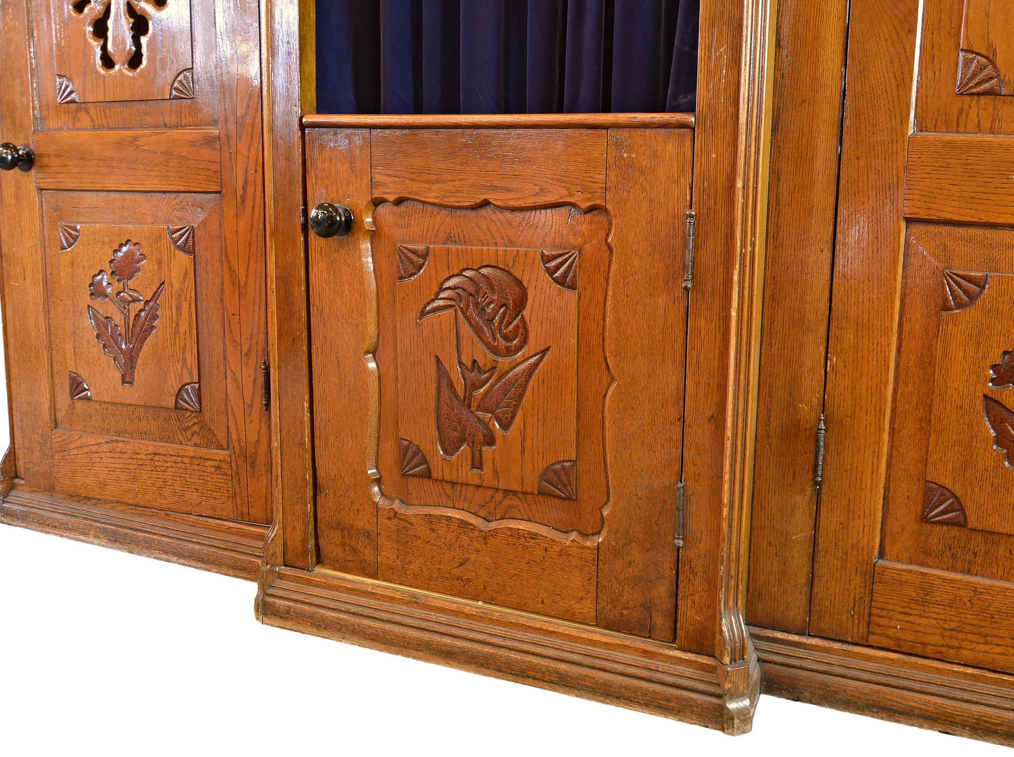 Amazing detail is found in this oak confessional floral detail adorn both the doors and sides of the unit and a wonderful carved screen is diplayed on both the two penitent booths.