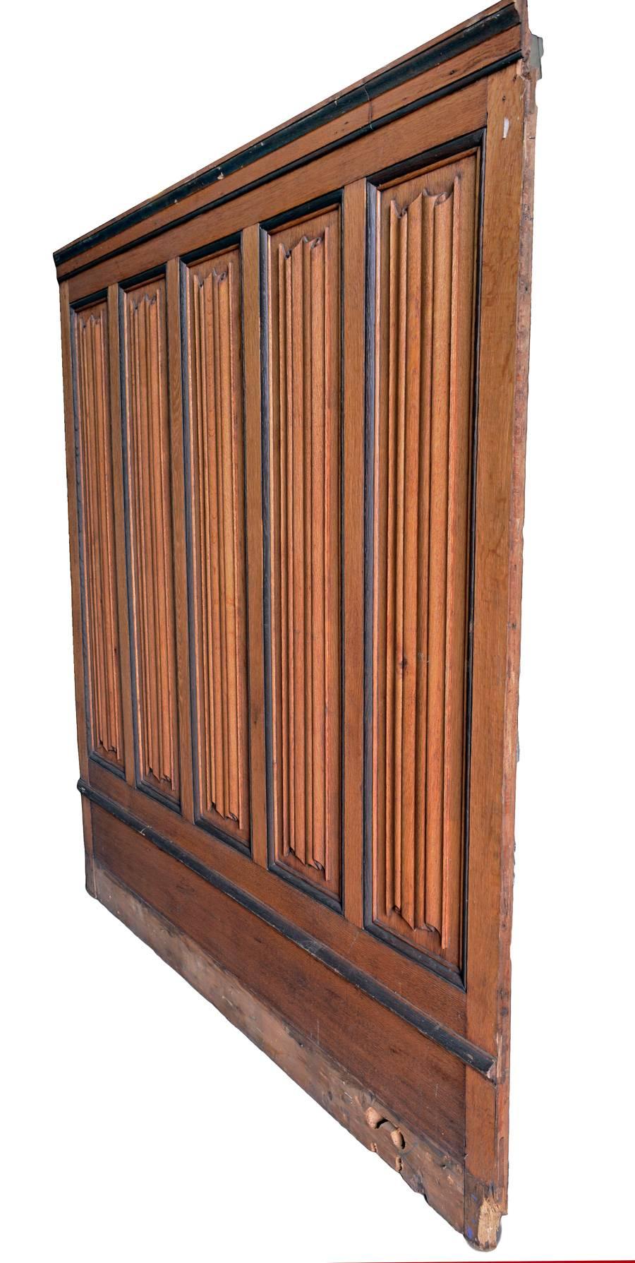Delicately carved wainscoting panels with linen fold motif. 
 There are three panels that are 60