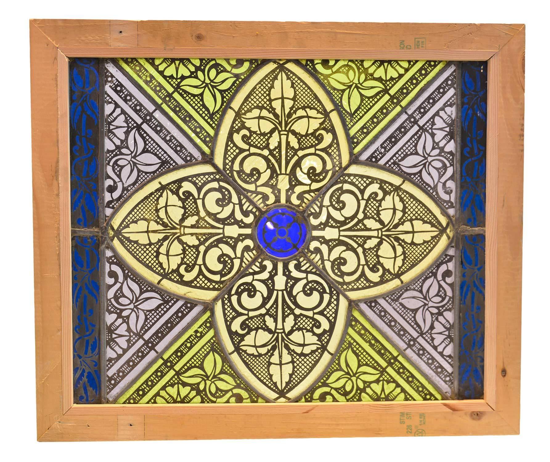These beautiful flashed glass windows feature stylized quatrefoil in yellow, green and purple, with Gothic floral details throughout. We still have one available: the borderless window as seen in the photos.

With border: 23.5" tall x